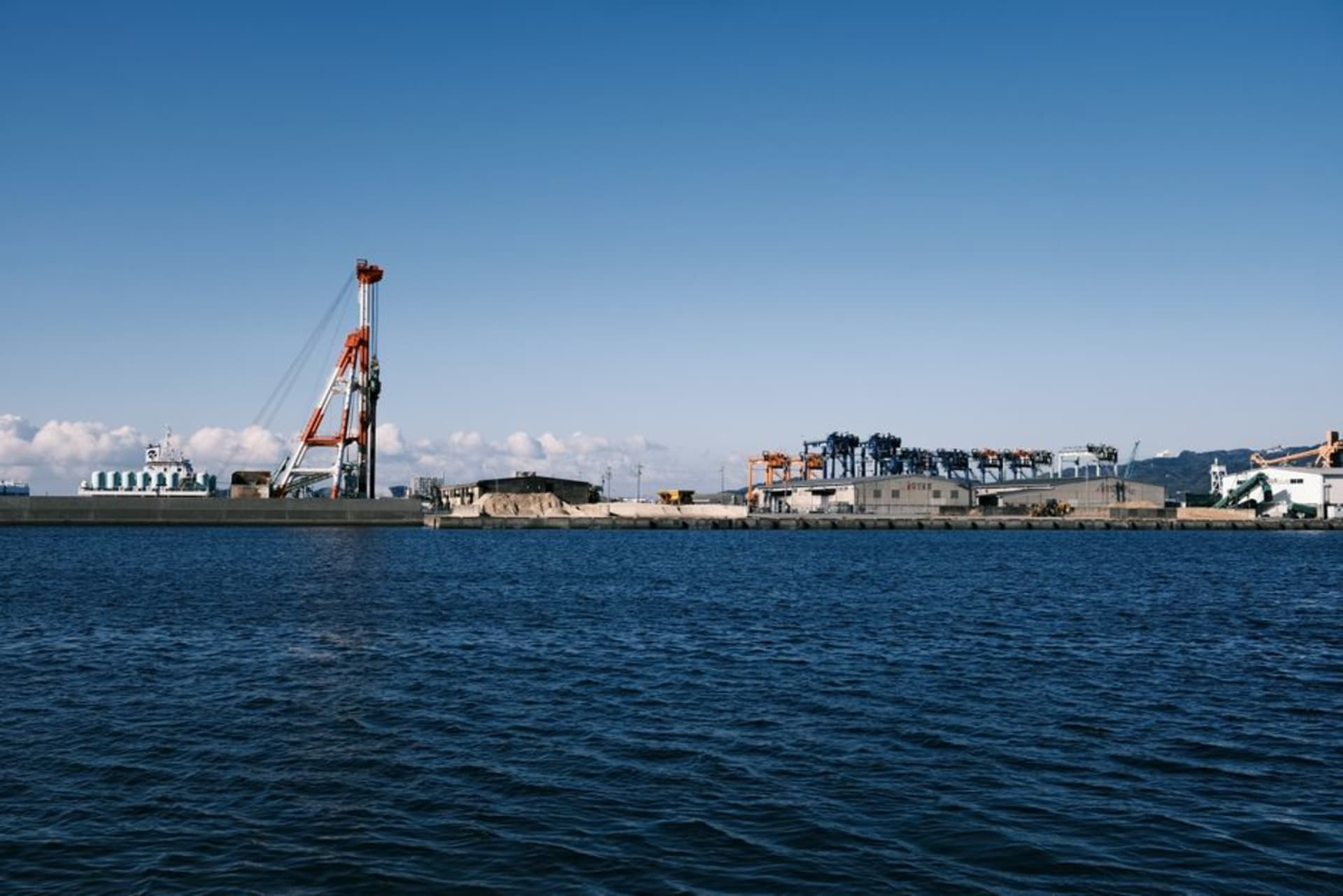 Hirado Castle above the harbour with the arched bridge to the island in the foreground
