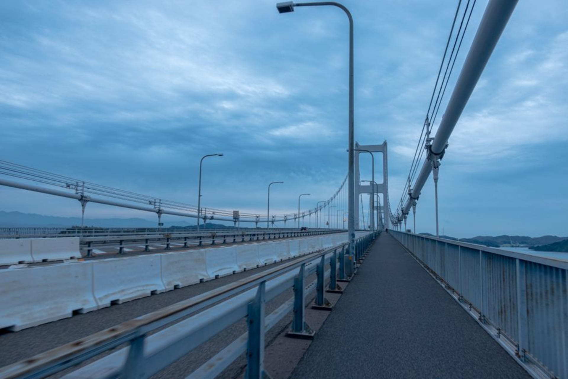 The Kurushima-Kaikyō Bridge stretching across the Seto Inland Sea at dusk near Imabari
