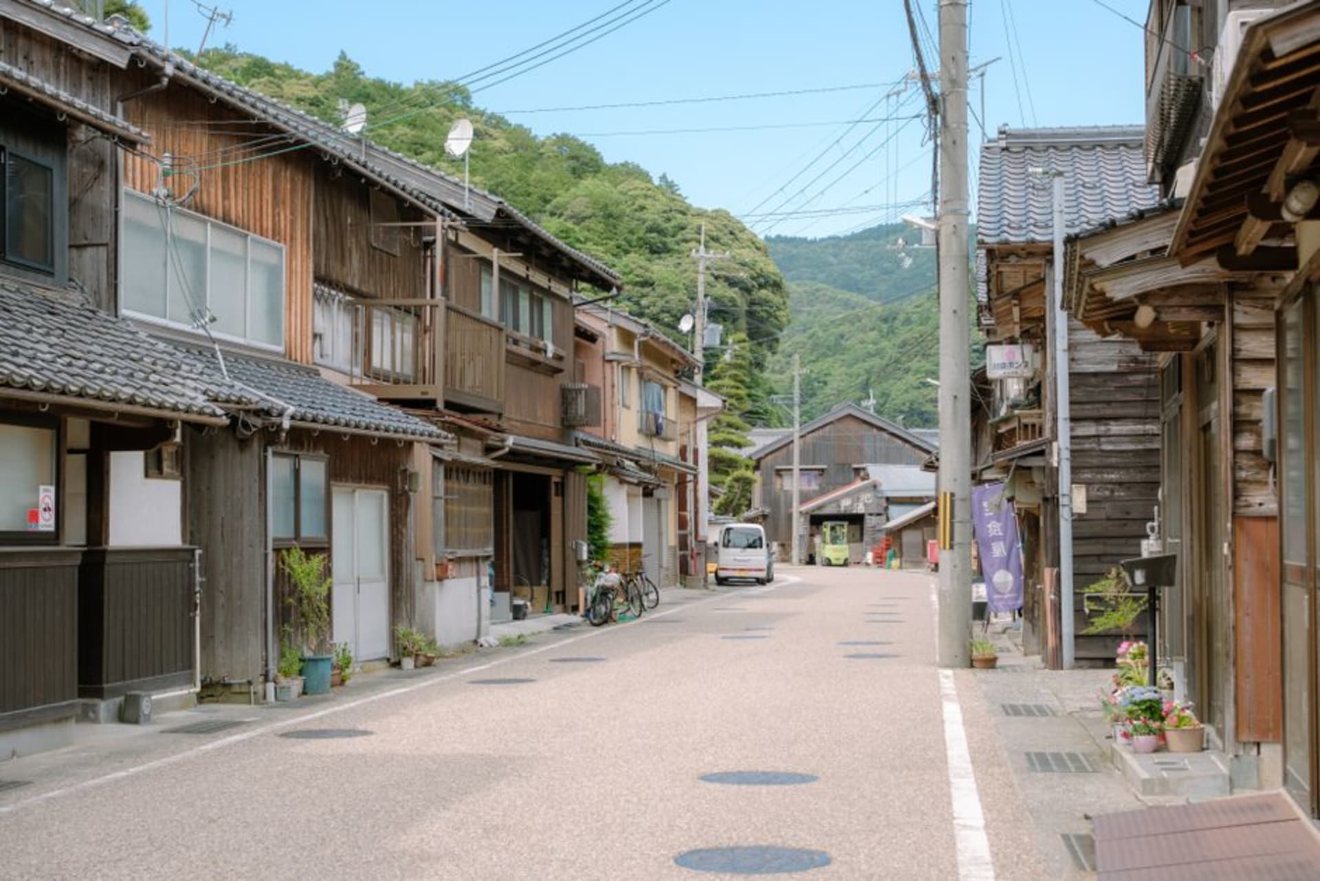 Temple rooftops and wooded hills above the bay town of Obama, Fukui