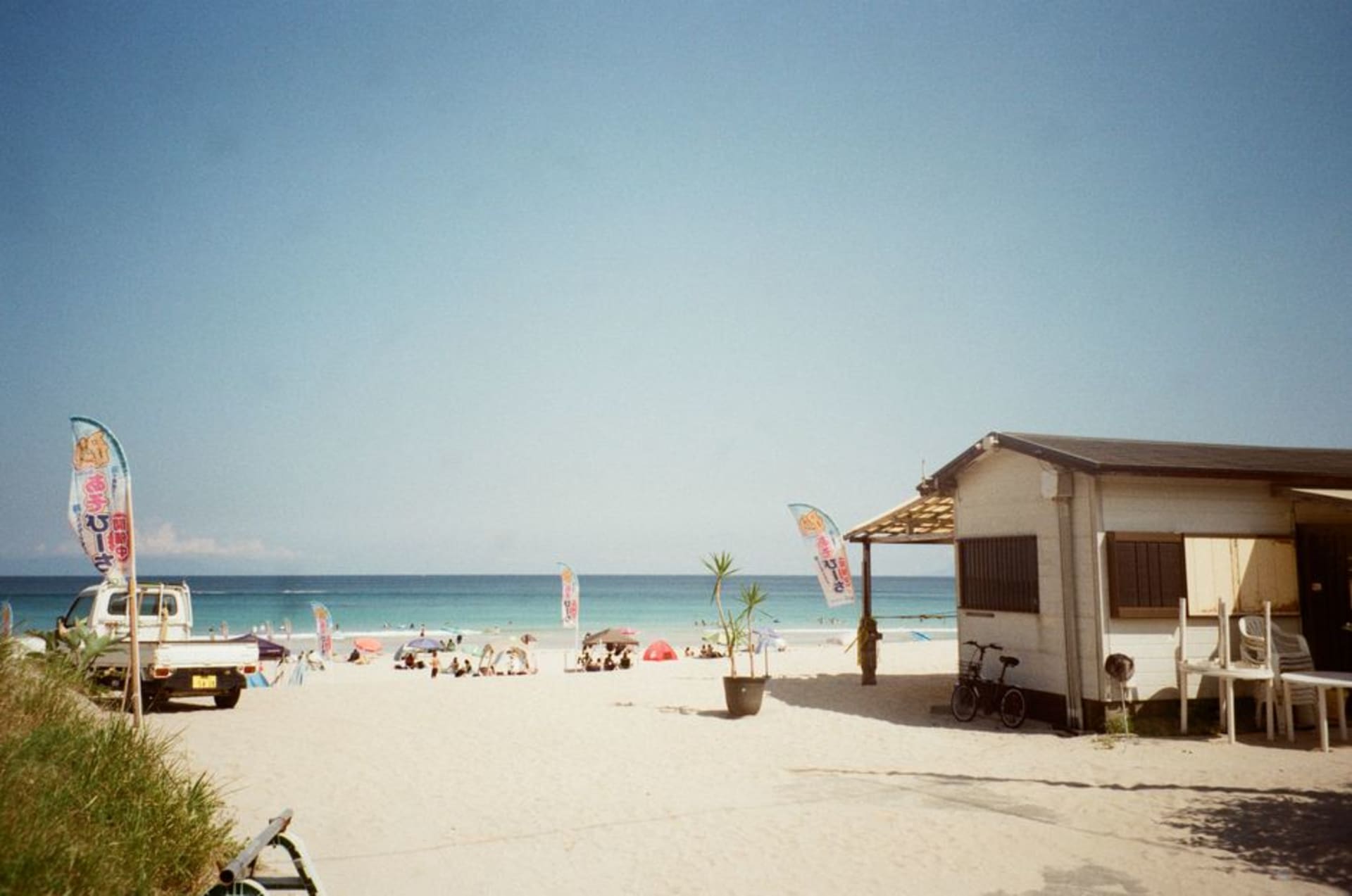 White-sand crescent of Shirahama beach at Shimoda under a blue Izu sky
