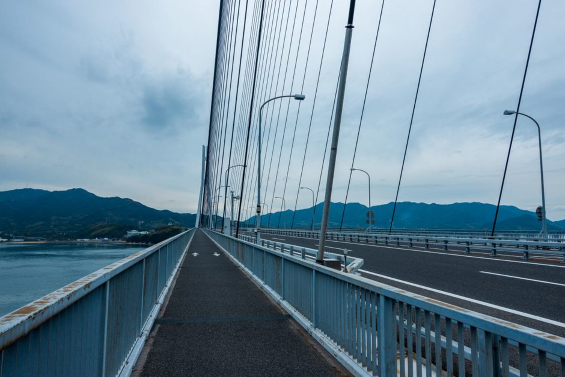 Ships crossing the Kanmon Strait beneath the great suspension bridge at Shimonoseki