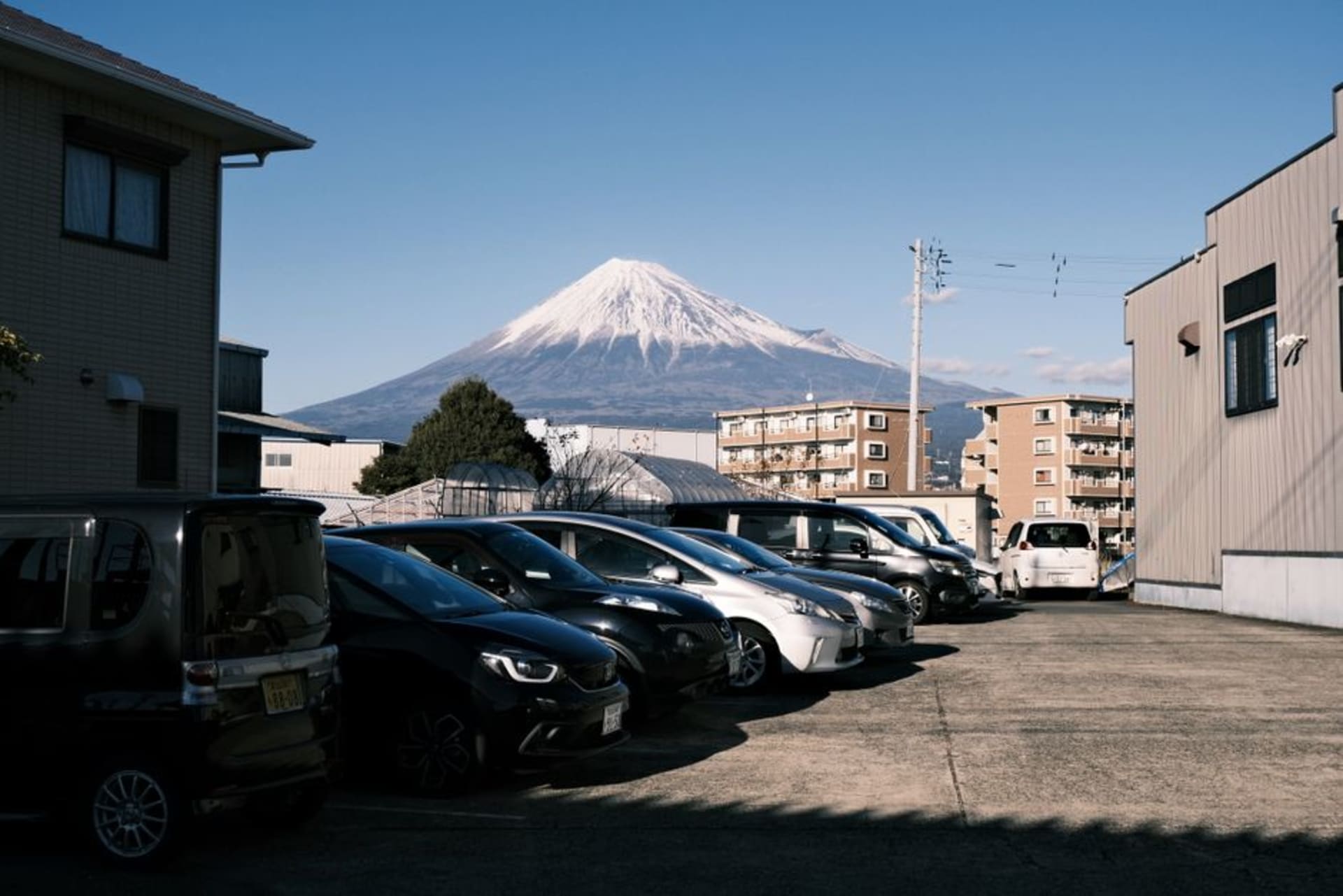 The symmetrical cone of Mount Daisen rising above the city of Yonago and Lake Nakaumi