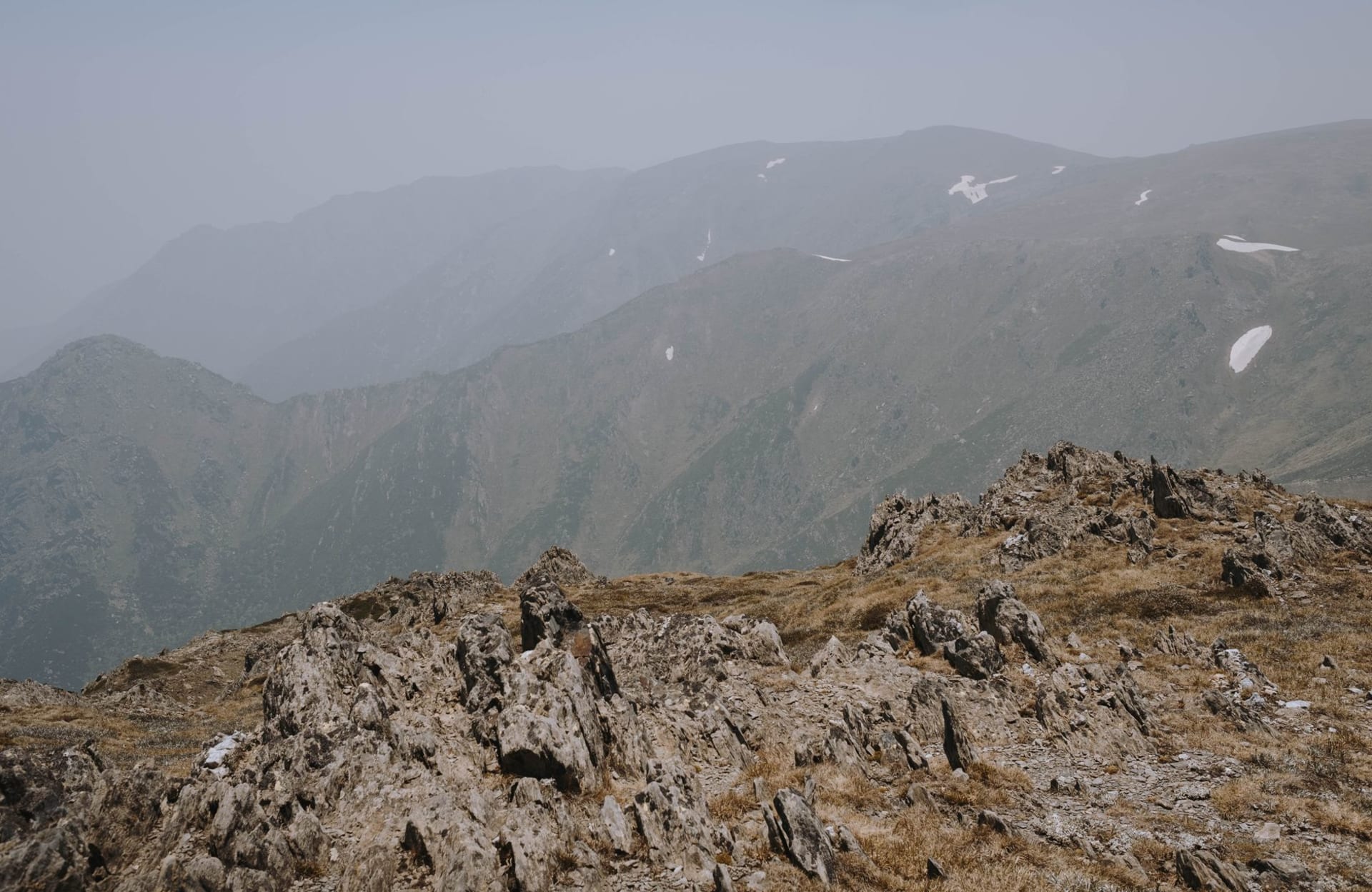 Bare green peaks and a glacial lake in the Sharr Mountains National Park, southern Kosovo
