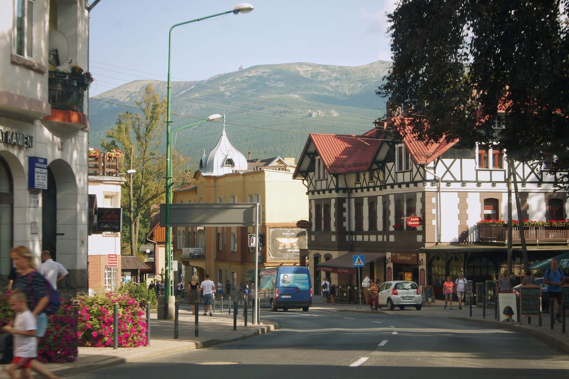 Keswick town centre market square with Skiddaw fell rising dramatically behind the rooftops