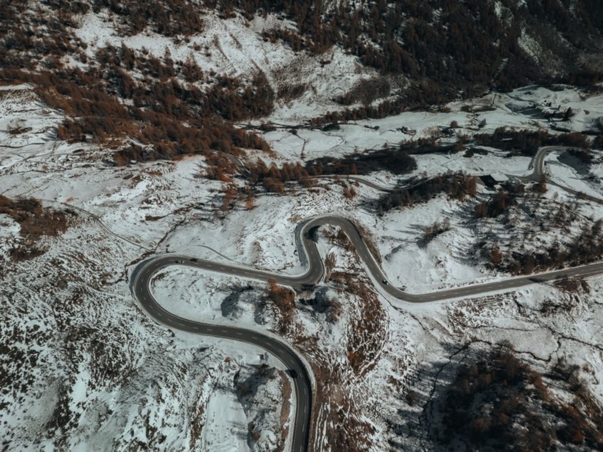The gravel switchbacks of Sani Pass climbing steeply through the Drakensberg-Maluti mountains
