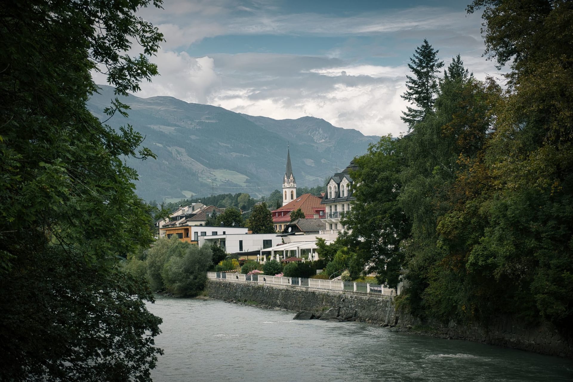 Gutenberg Castle rising dramatically from a wooded basalt hill above the quiet village of Balzers, vineyards in the foreground