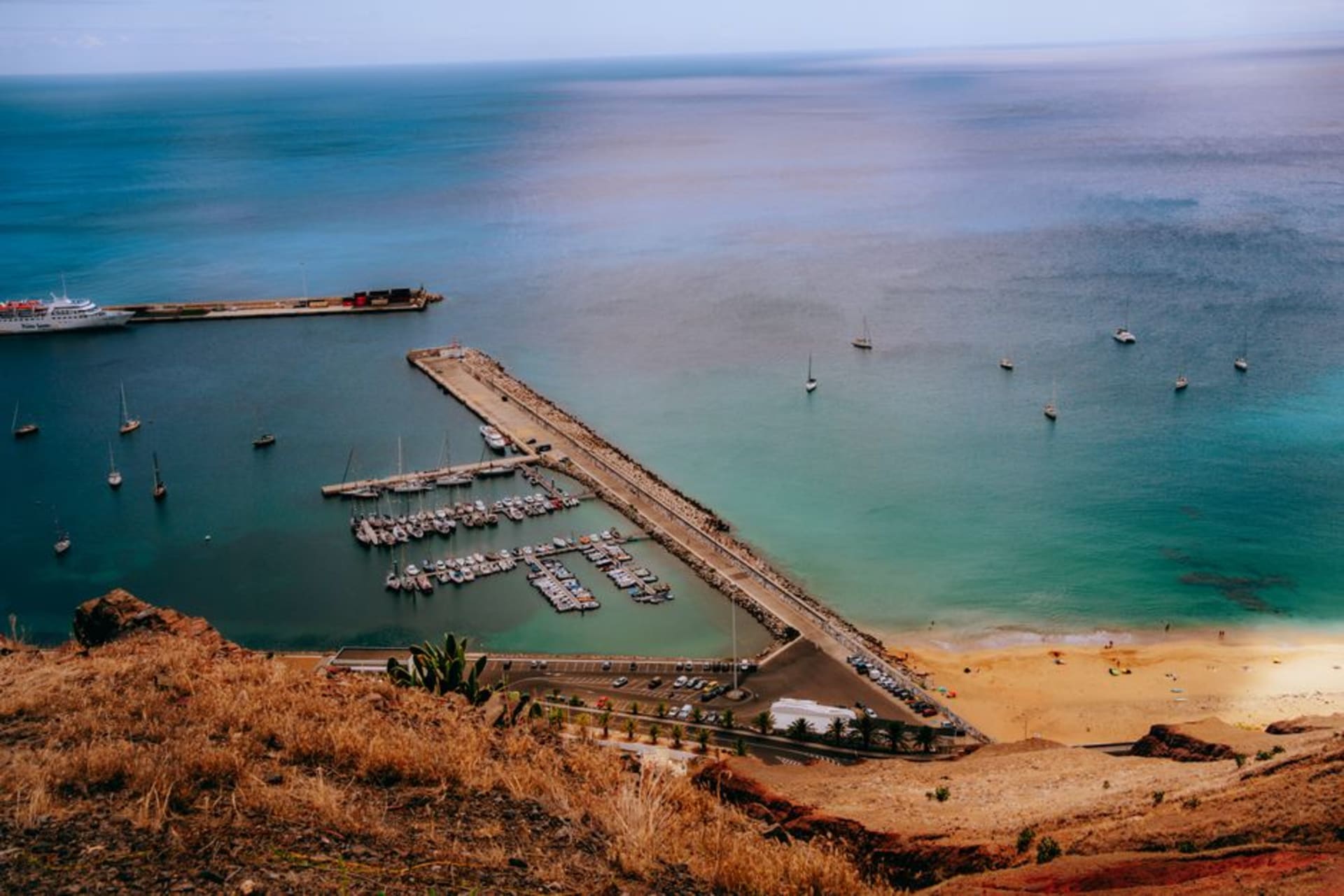 Golden sand beach of Porto Santo stretching along the coastline under a clear sky