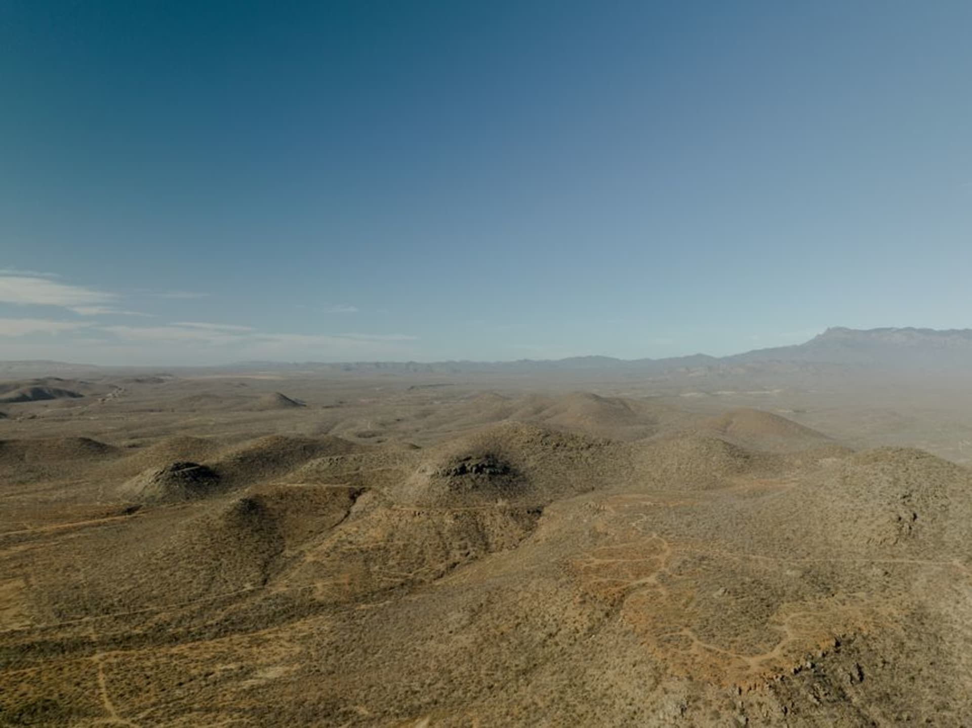 Dry ochre canyon landscape of the Mixteca Baja with organ pipe cacti and eroded hillsides near Santiago Juxtlahuaca, Oaxaca