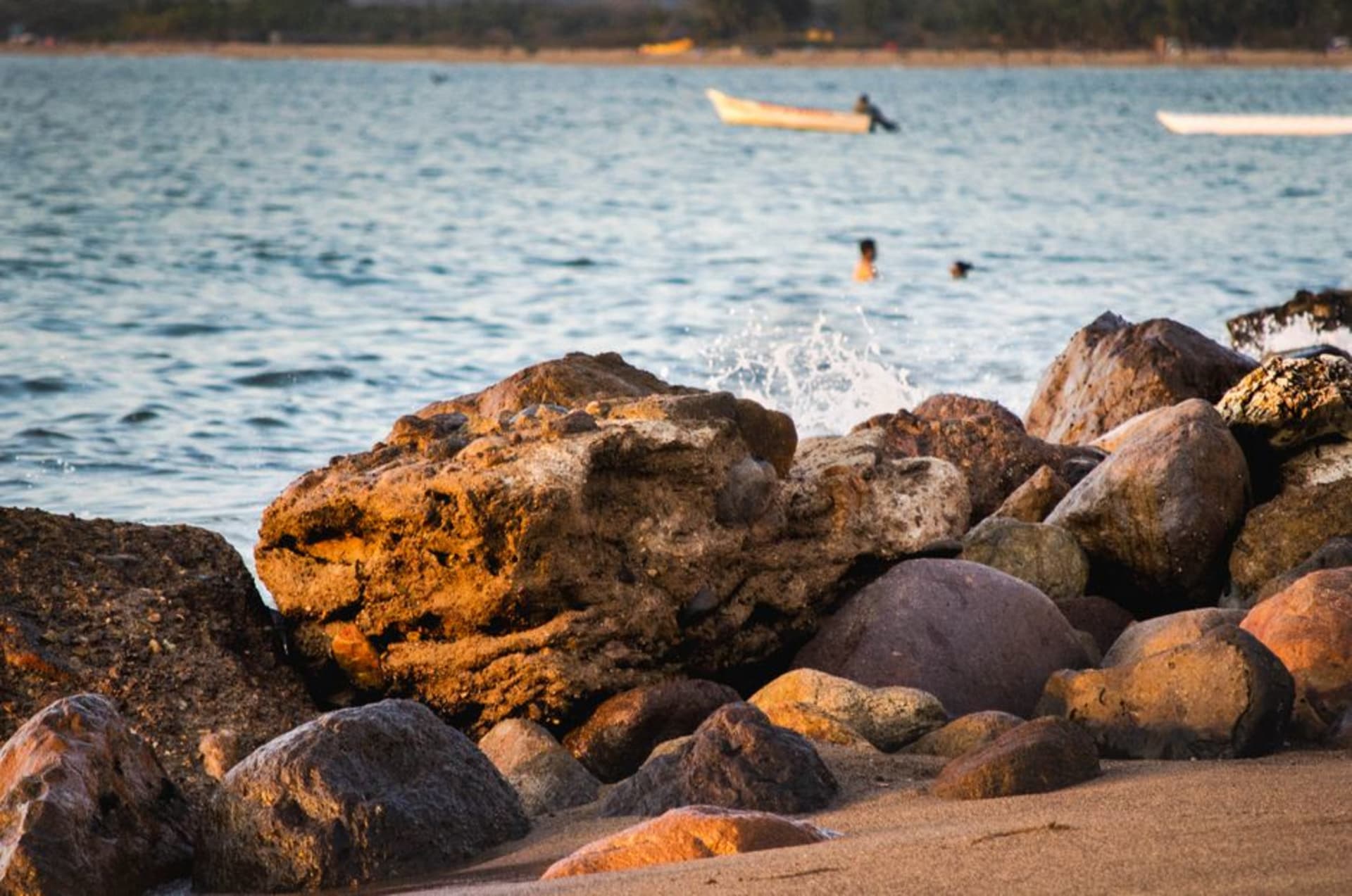 Fishing pangas at low tide along the malecón of La Peñita de Jaltemba with the broad bay glinting in early morning light