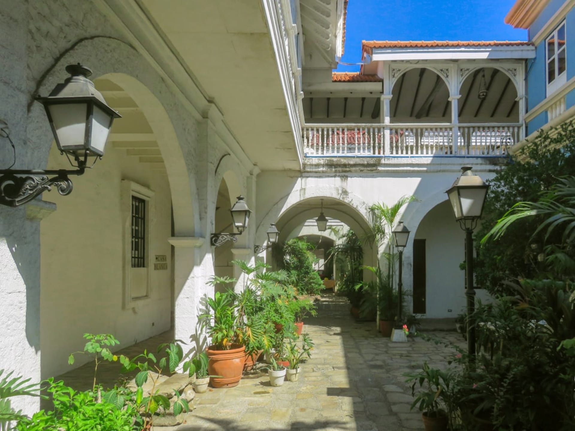Stone archways of a former sugar hacienda in Mazatepec, surrounded by mango trees and tropical light