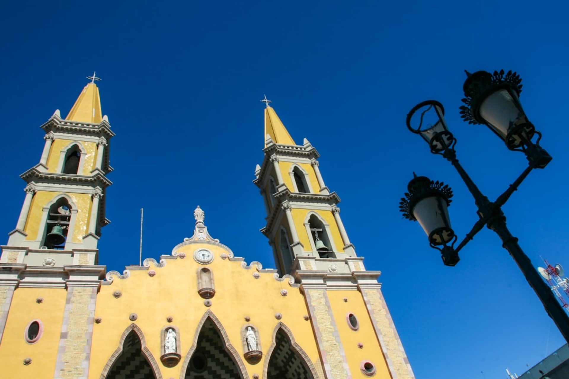 The historic centro and Malecón of Mazatlán in Sinaloa, the Pacific resort city's 19th-century buildings along the seafront promenade, the cathedral visible above the rooflines