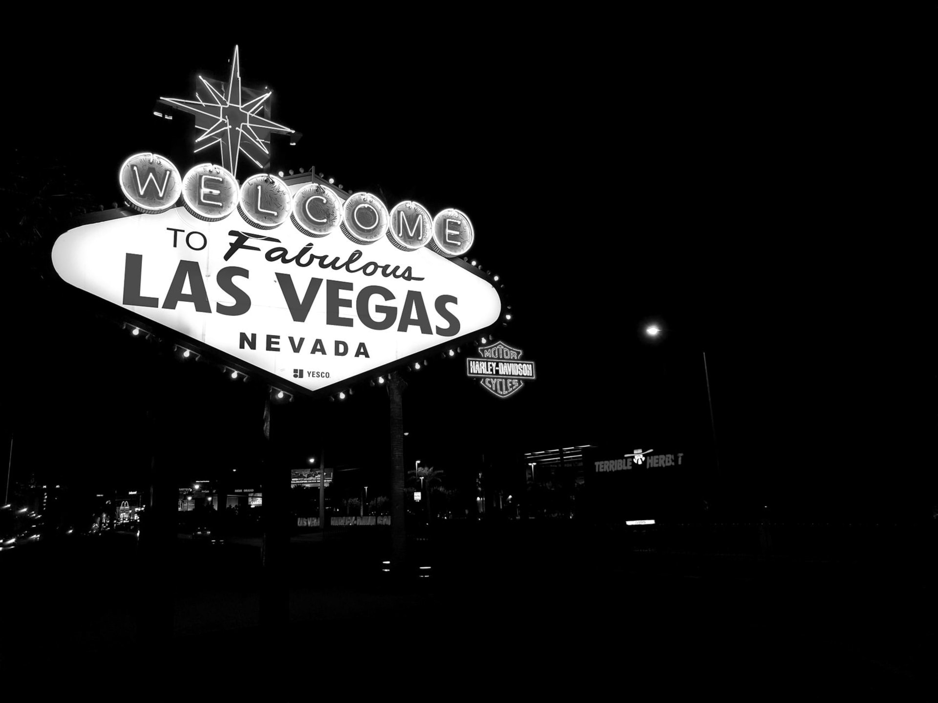 Las Vegas Strip at night with neon casino lights glowing against the dark sky