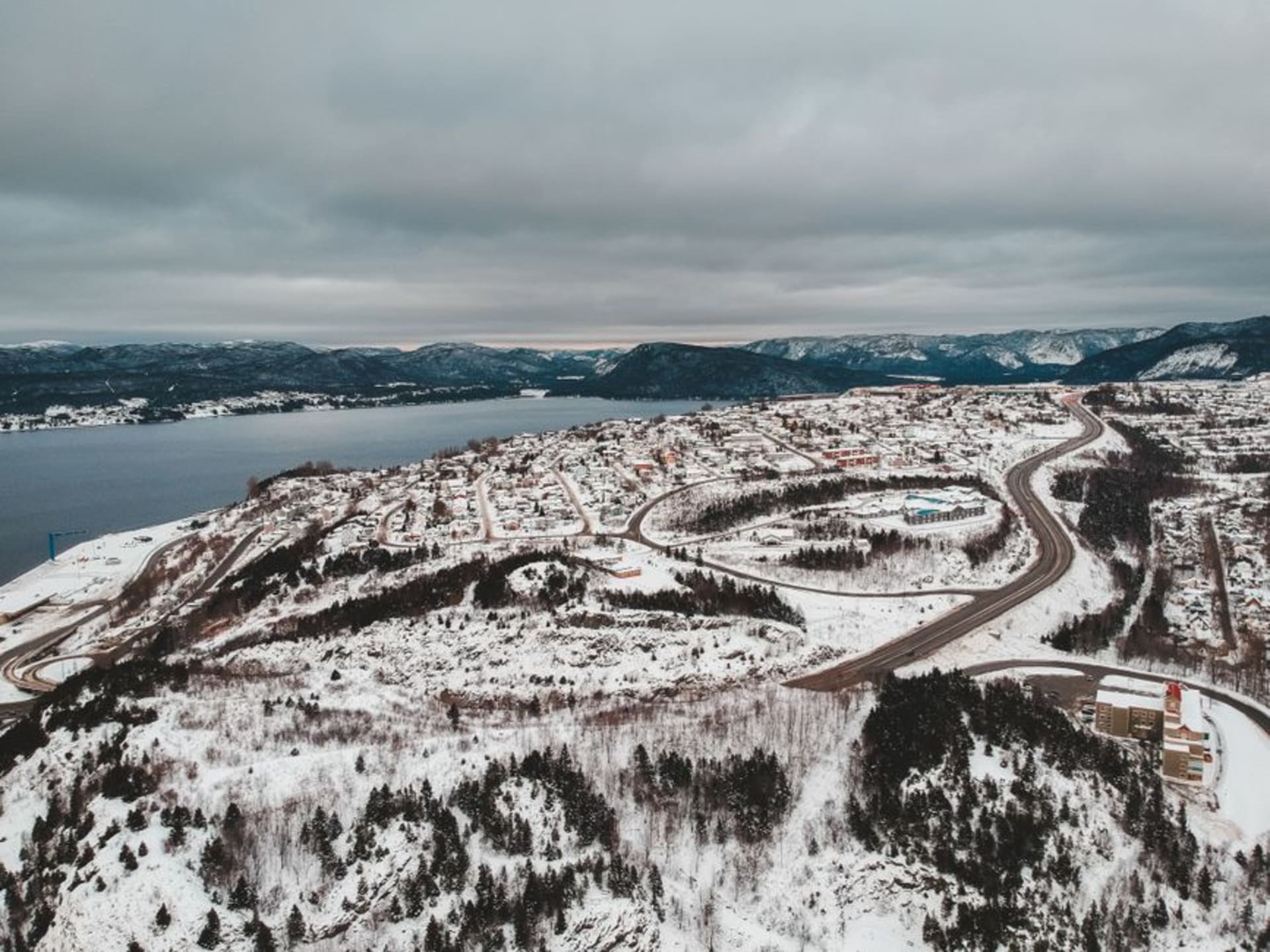 The Bay of Islands and Corner Brook's mill skyline seen from a hillside above the city