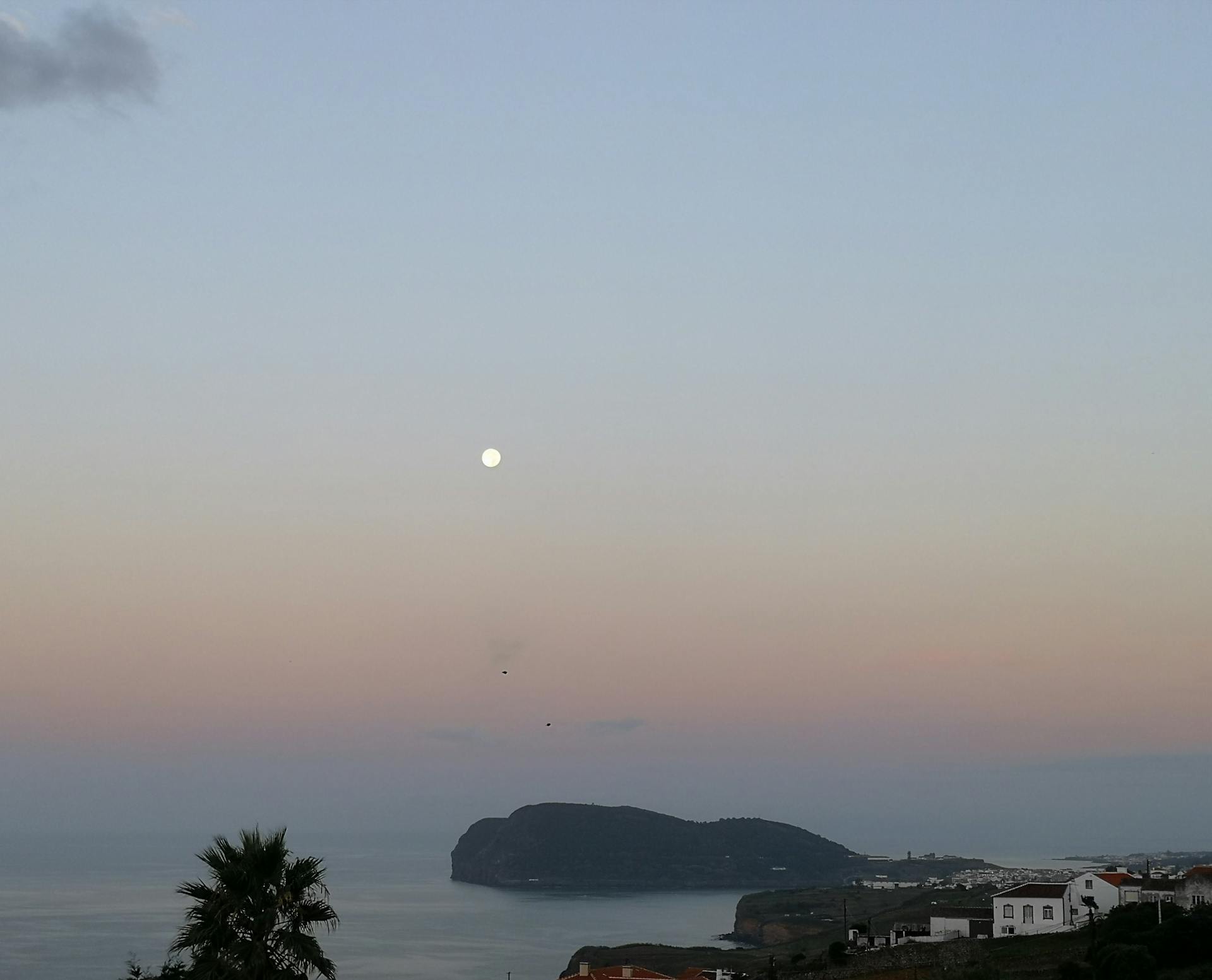 Colourful colonial street in Granada with cathedral towers and Mombacho volcano