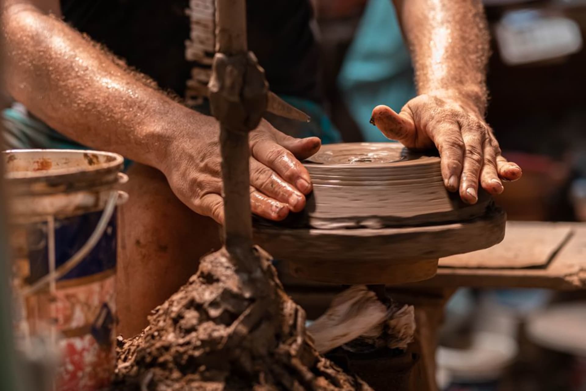 A potter shaping pre-Columbian style ceramics by hand in San Juan de Oriente