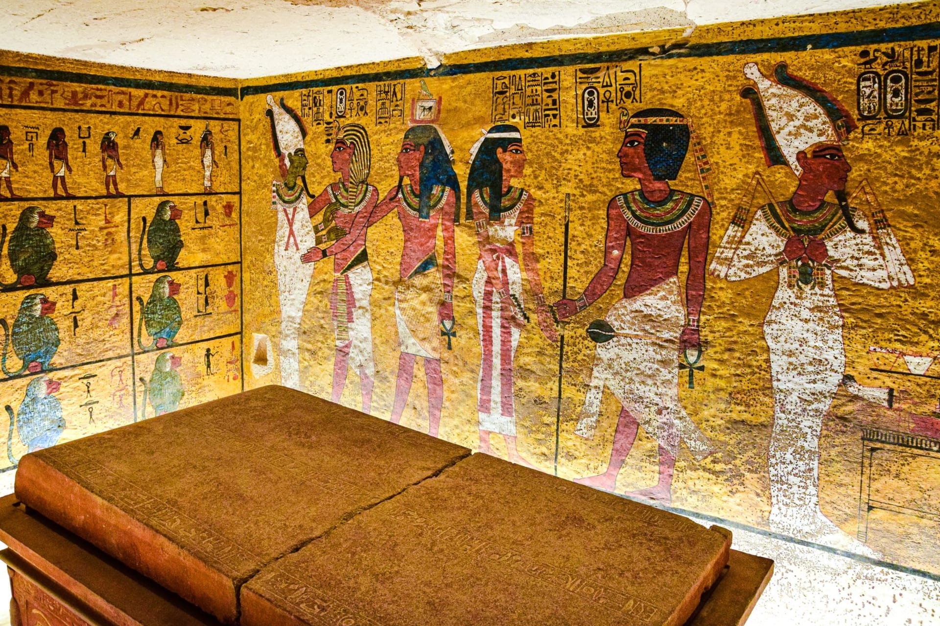 The painted walls of the Temple of Seti I at Abydos, colours still vivid in the hypostyle hall, the site nearly deserted under blue desert sky