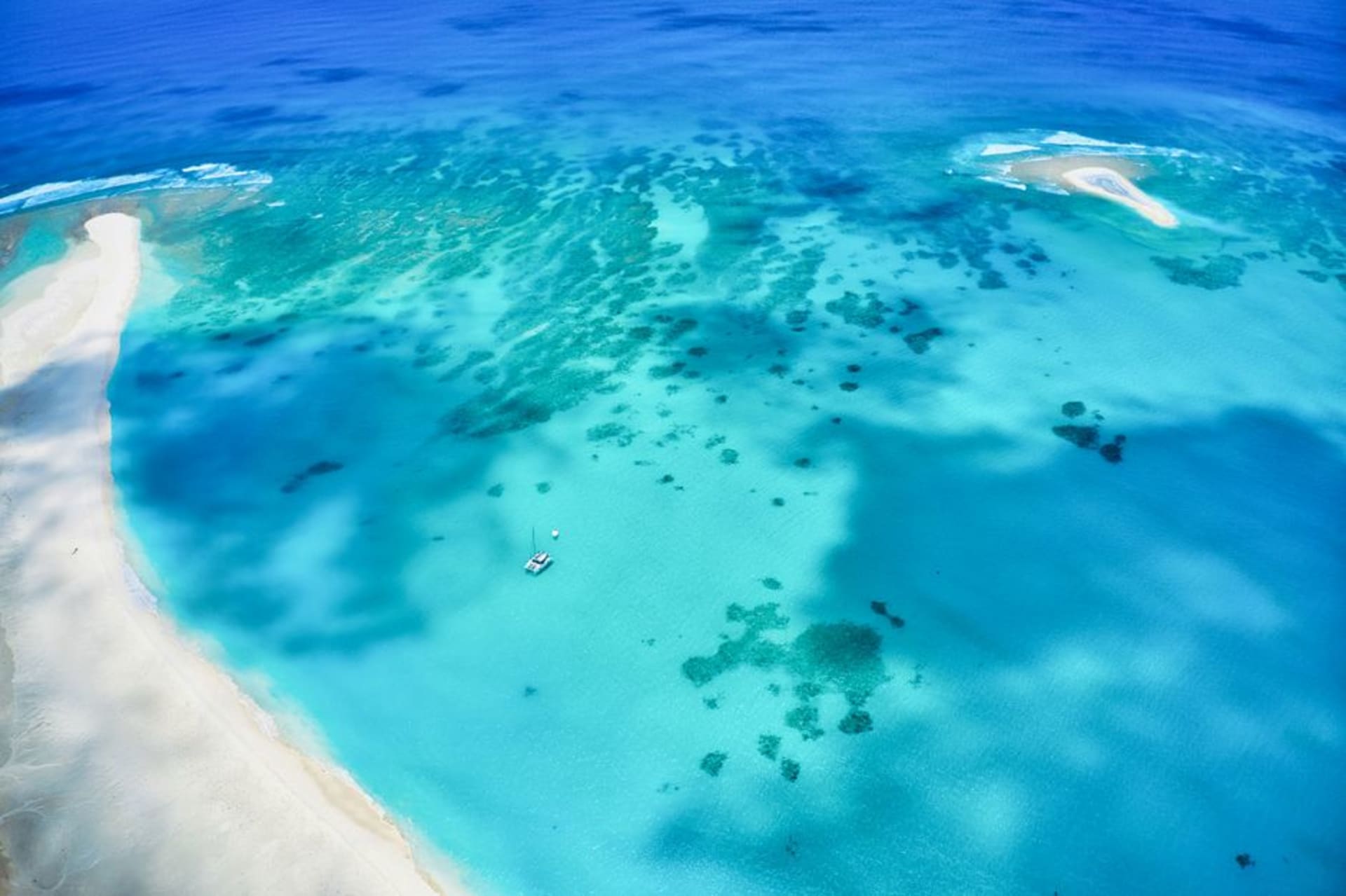 The white sandbar of Hatenohama stretching into the turquoise Kerama Sea off Kume Island