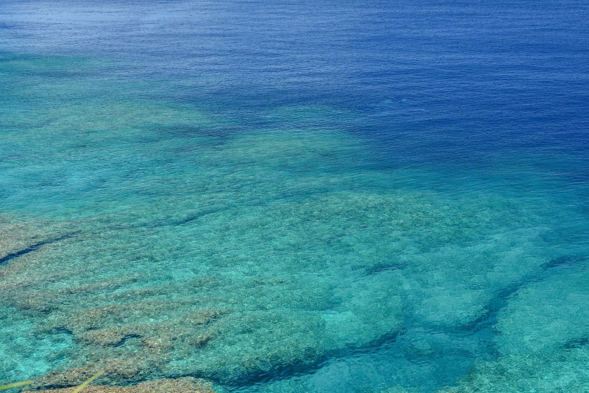 Azure waters revealing a stunning coral reef off the coast of Okinawa, Japan