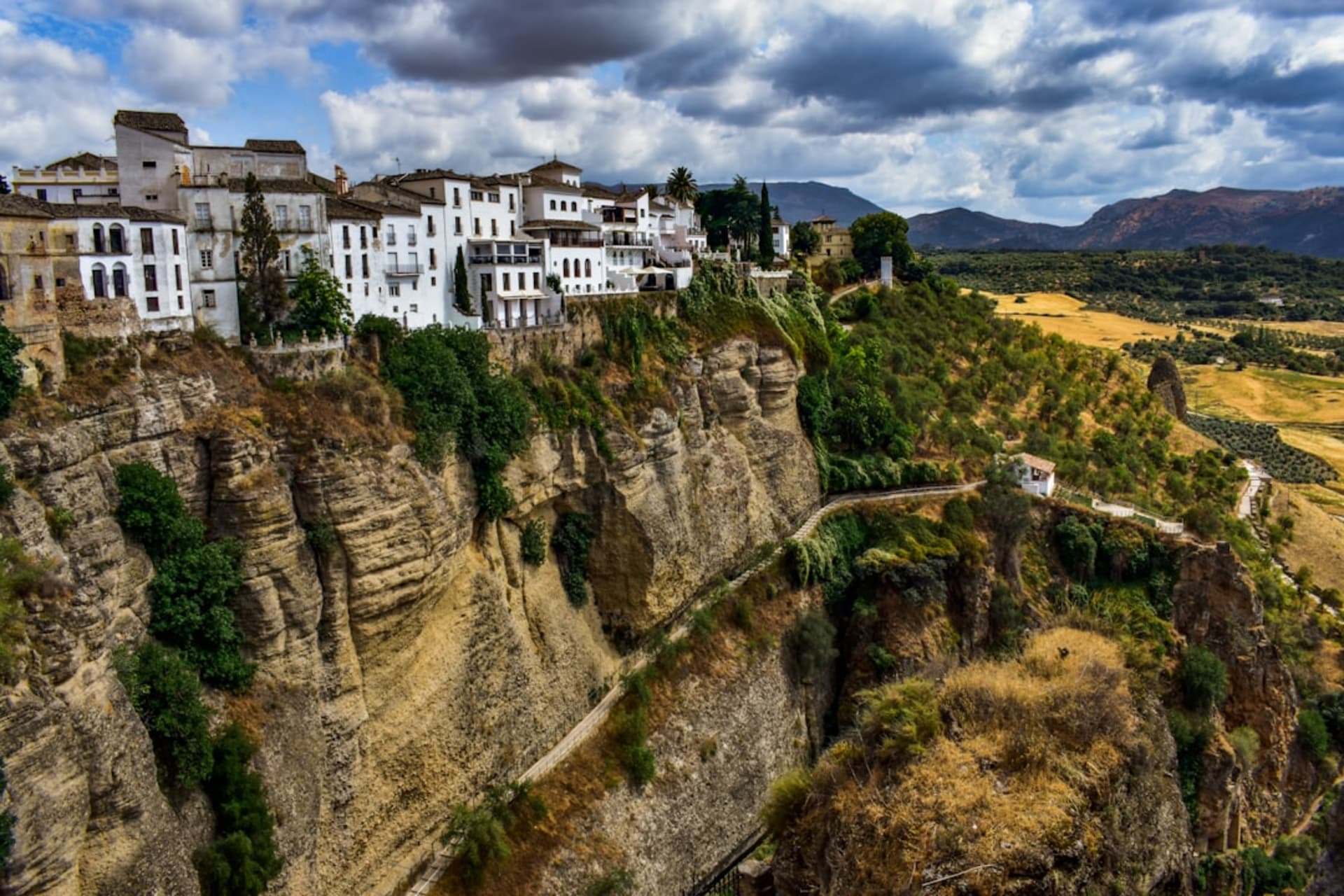 The stone walls and domes of Mar Saba Monastery clinging to a cliff face above the Kidron Valley canyon