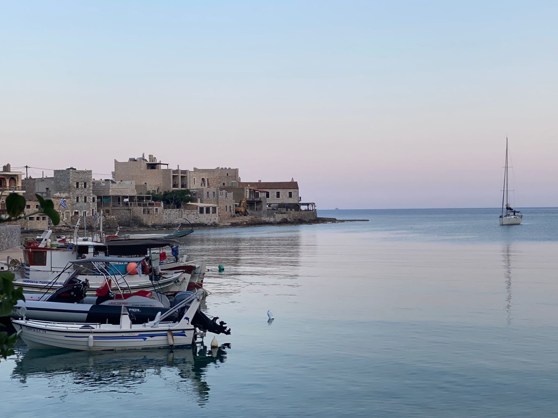 Stone tower houses of Vathia village rising against the blue Ionian sky on the Mani Peninsula at sunset