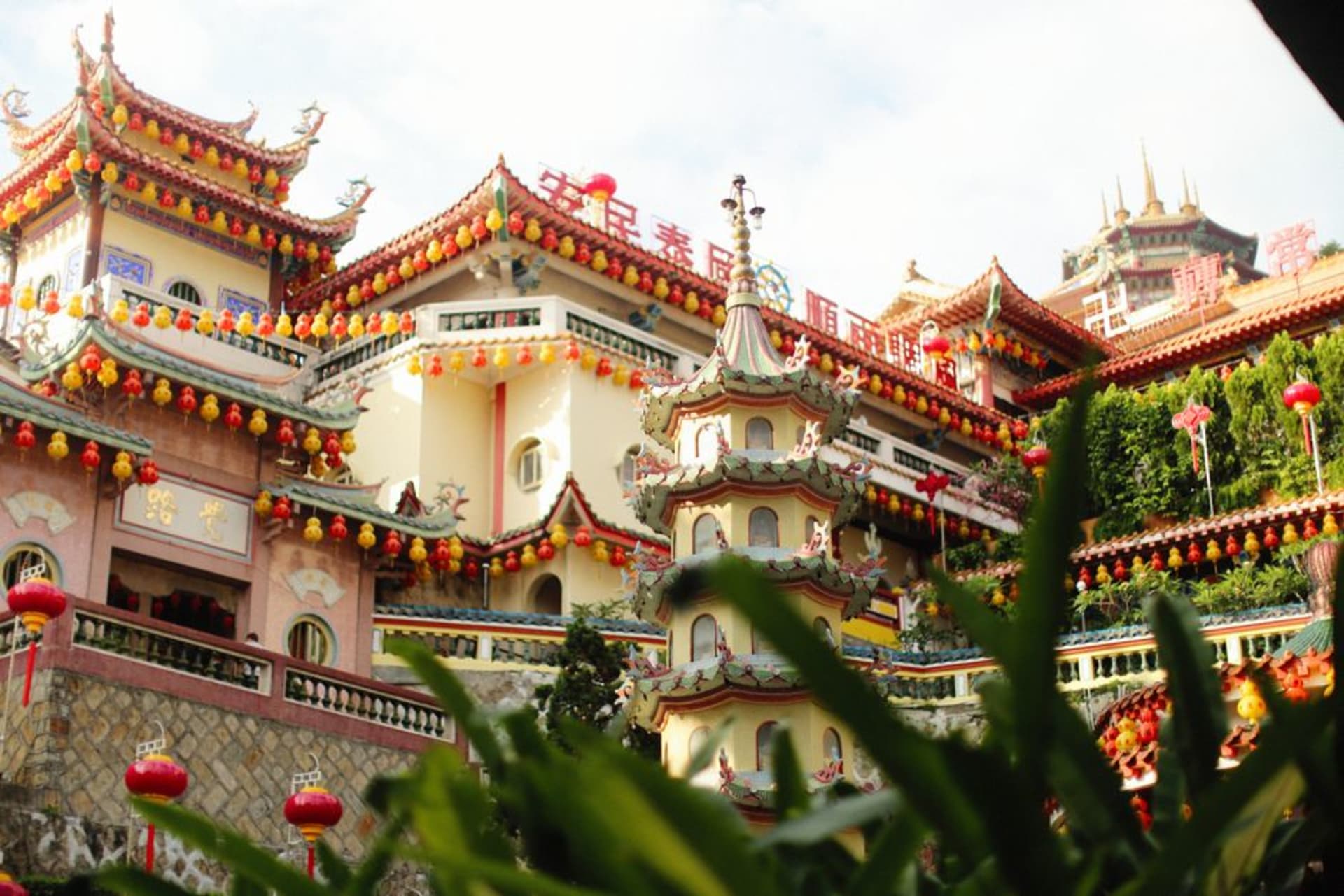 The seven-tier Pagoda of Rama VI rising above the rooftops of Kek Lok Si temple complex