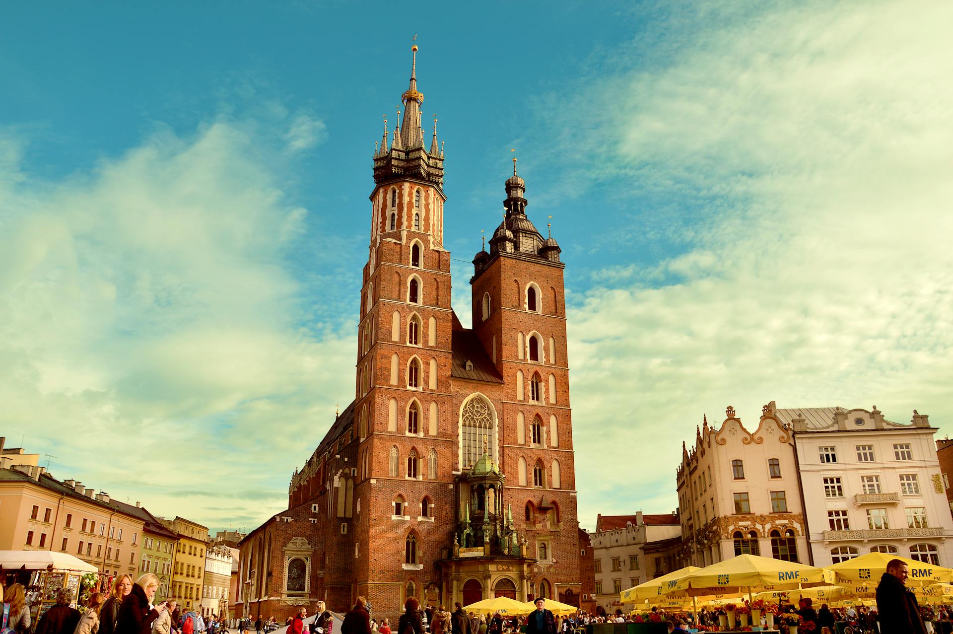 Medieval Gothic brick buildings along the Vistula River in Toruń at sunset