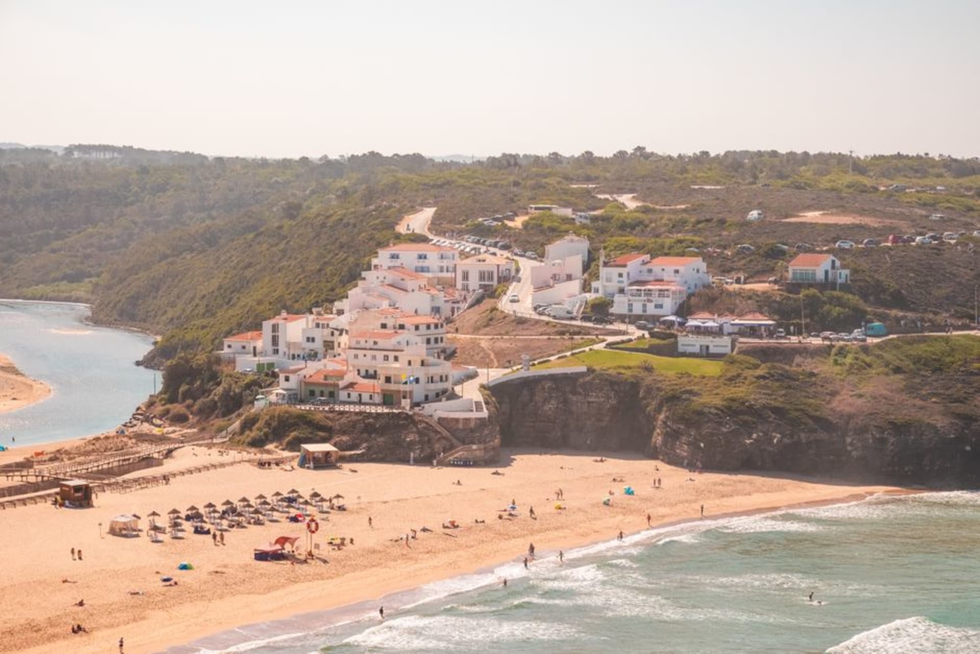 The Odeceixe river winding through golden dunes to meet the Atlantic Ocean at Praia de Odeceixe