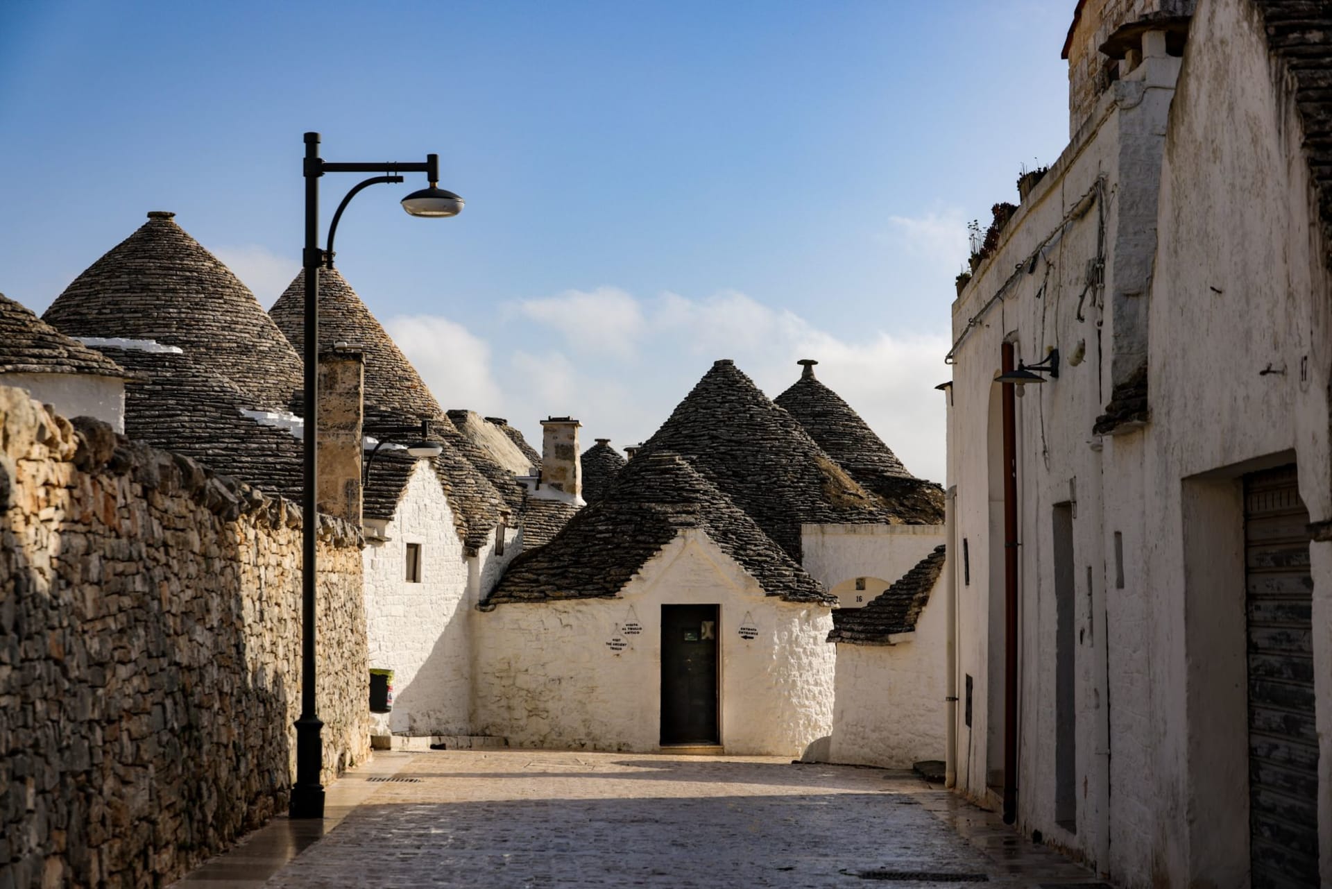 Iconic trulli stone houses with conical roofs in Alberobello, Puglia