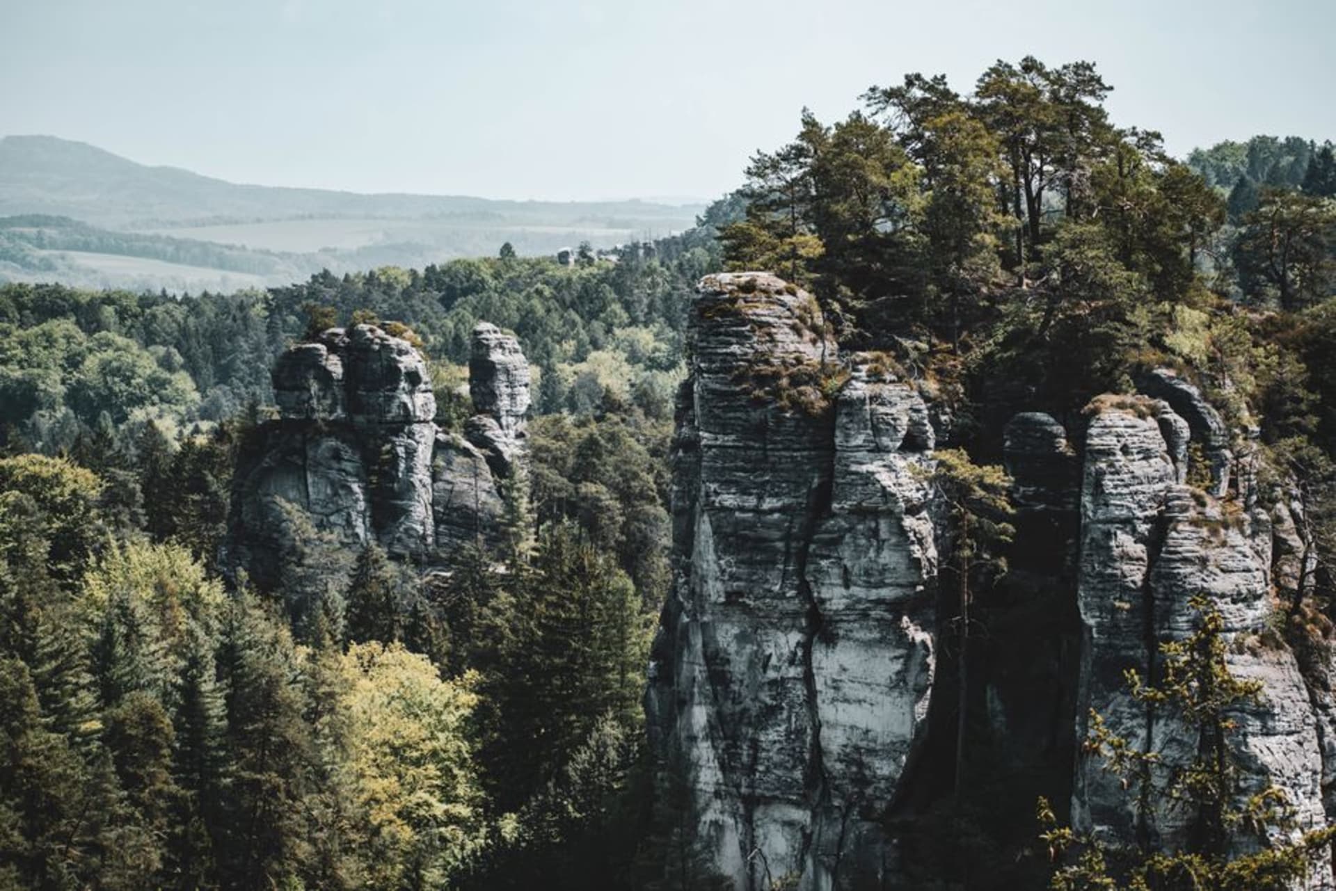 Towering syenite rock pillars rising above the taiga forest at Stolby Nature Reserve