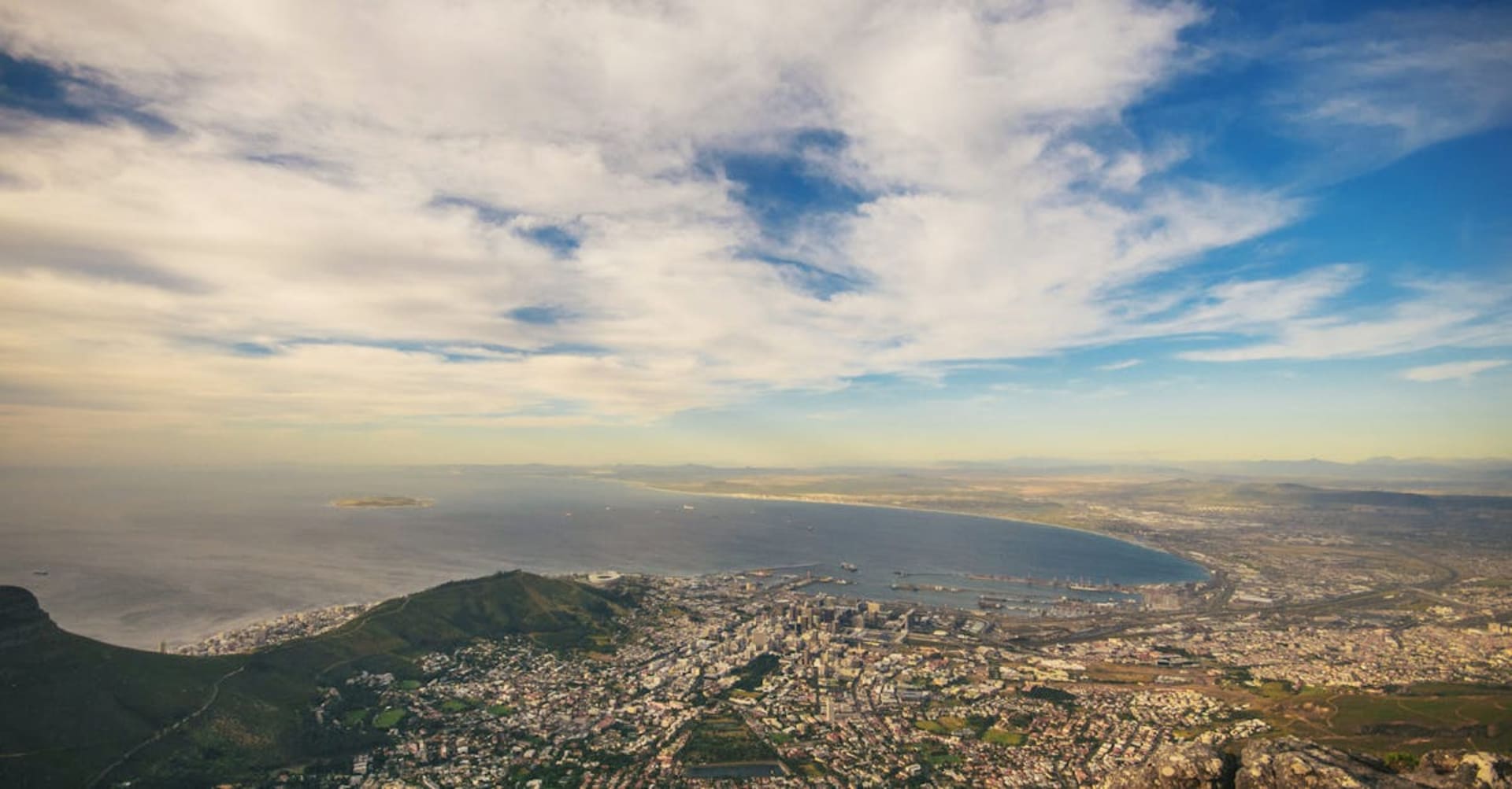 Aerial view of Cape Town with Table Mountain's flat summit and the harbor below
