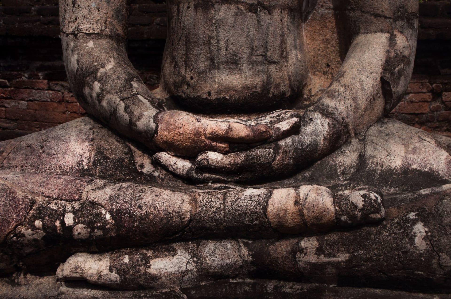 The serene rock-carved reclining Buddha of Gal Vihara in Polonnaruwa, golden granite glowing in afternoon light against the dry-zone forest