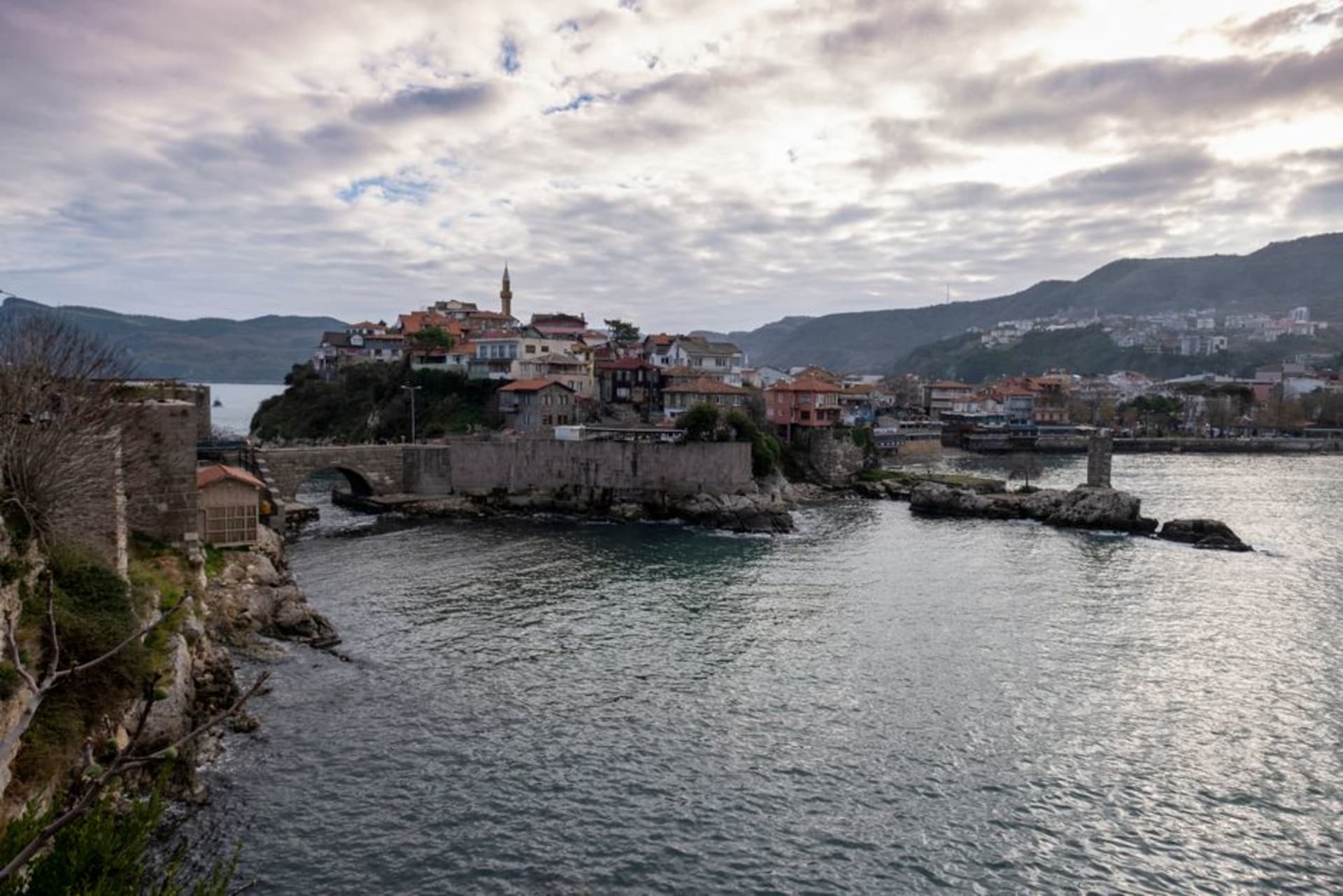 Sinop's peninsula jutting into the Black Sea with the old fortress walls in the foreground