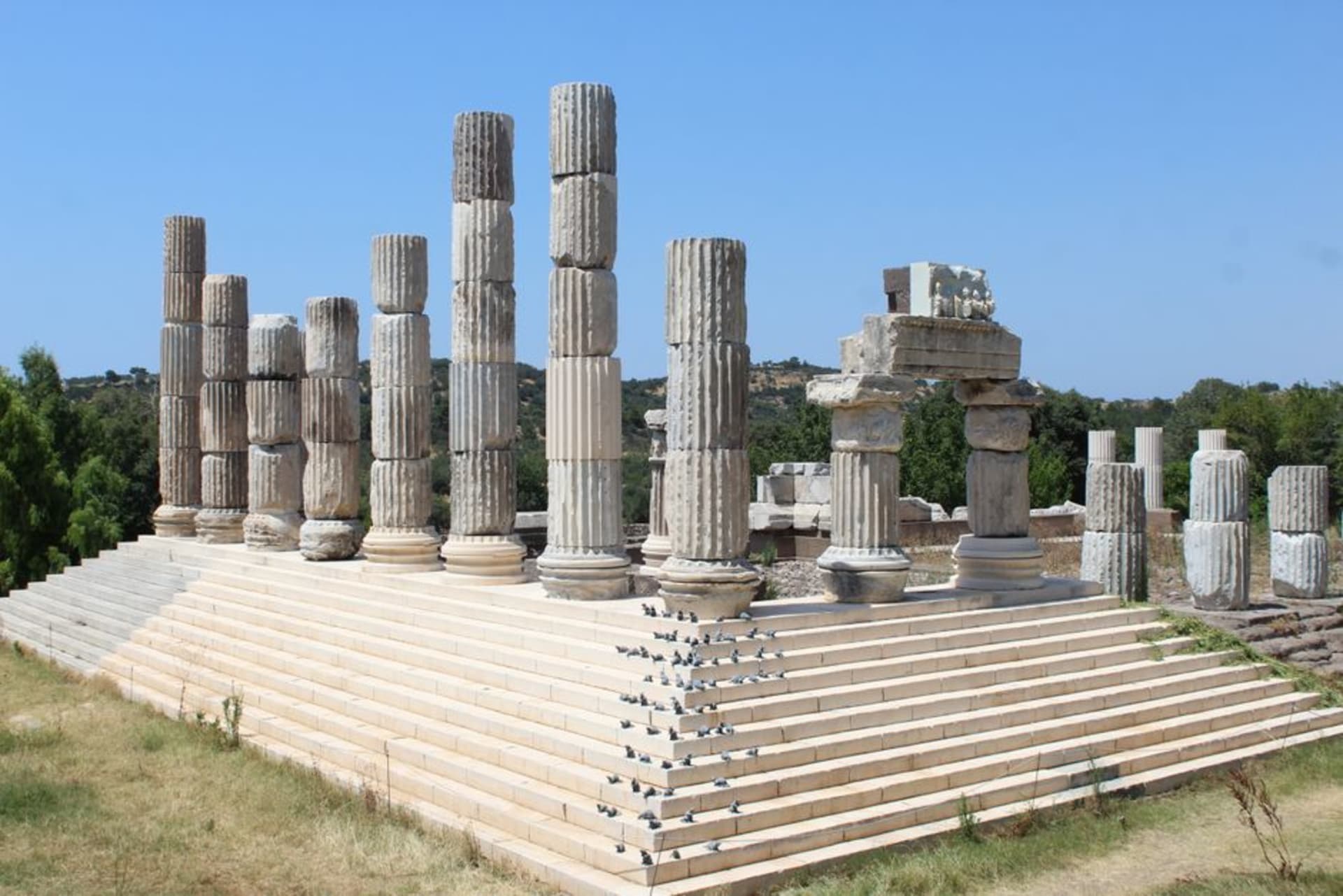 Ancient stone walls and excavated layers of Troy under a wide sky near the Dardanelles