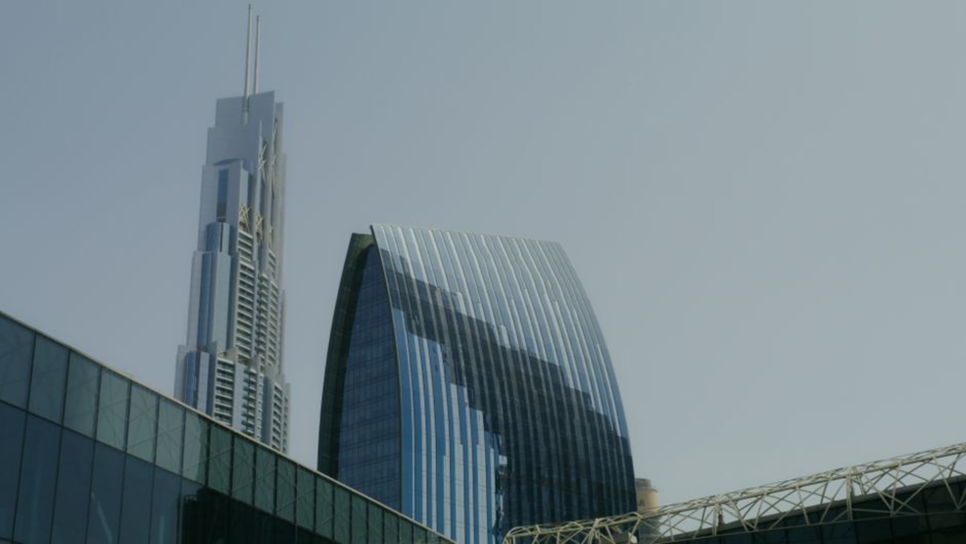 Concrete and glass studio buildings with exposed industrial detailing in Dubai Design District