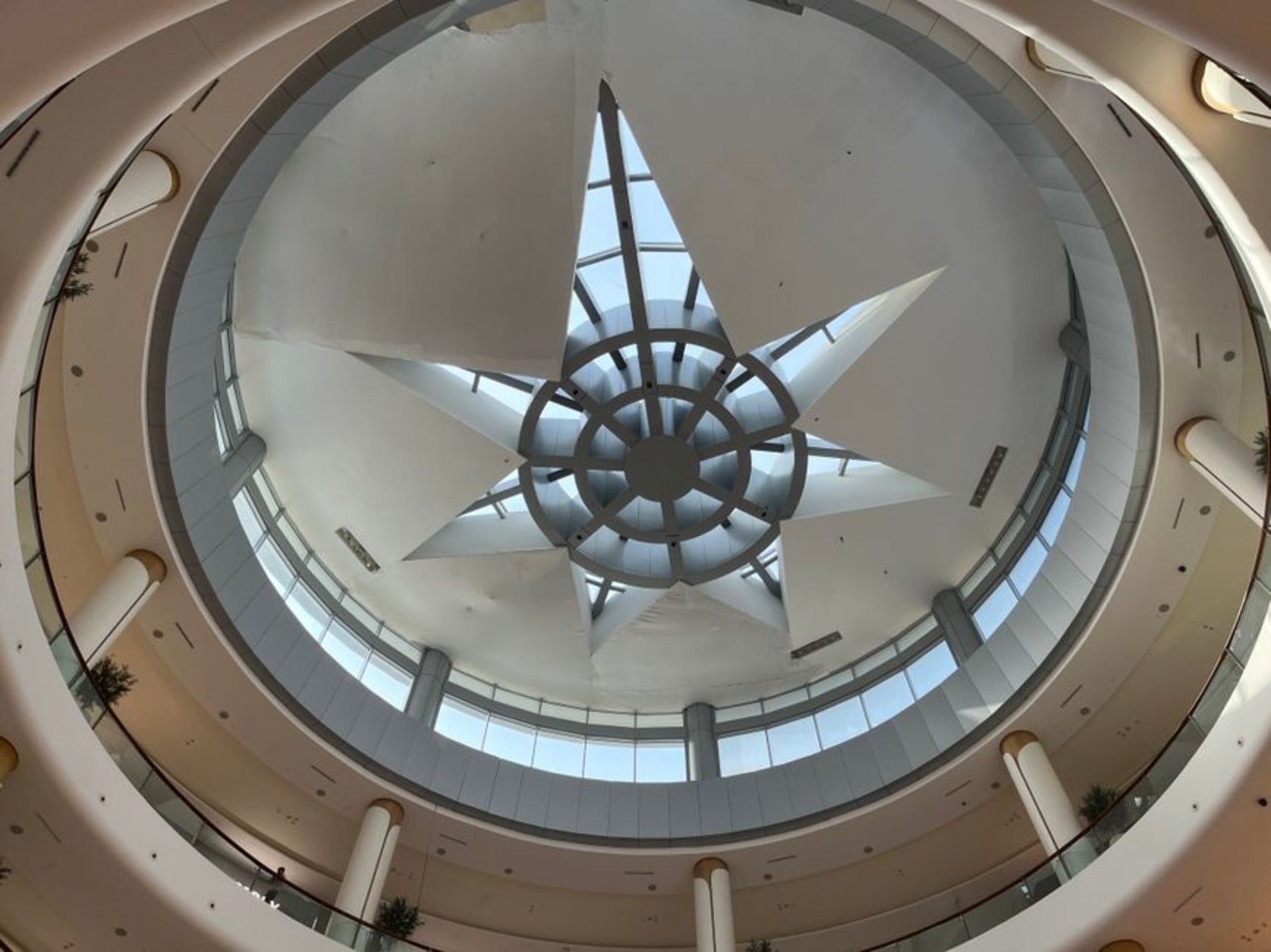 The vast interior atrium of Dubai Mall with the aquarium visible in the background