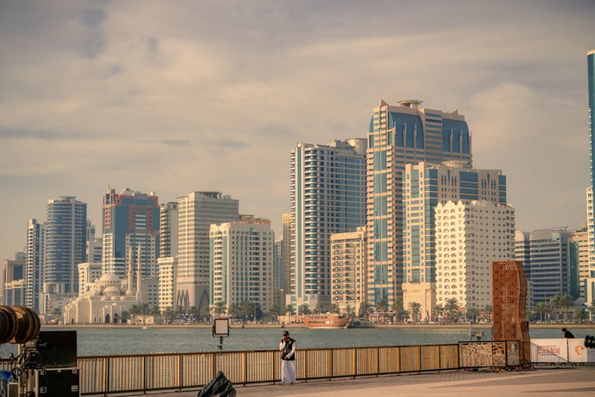 Restored coral-stone buildings and narrow alleys in the Heart of Sharjah district at dusk