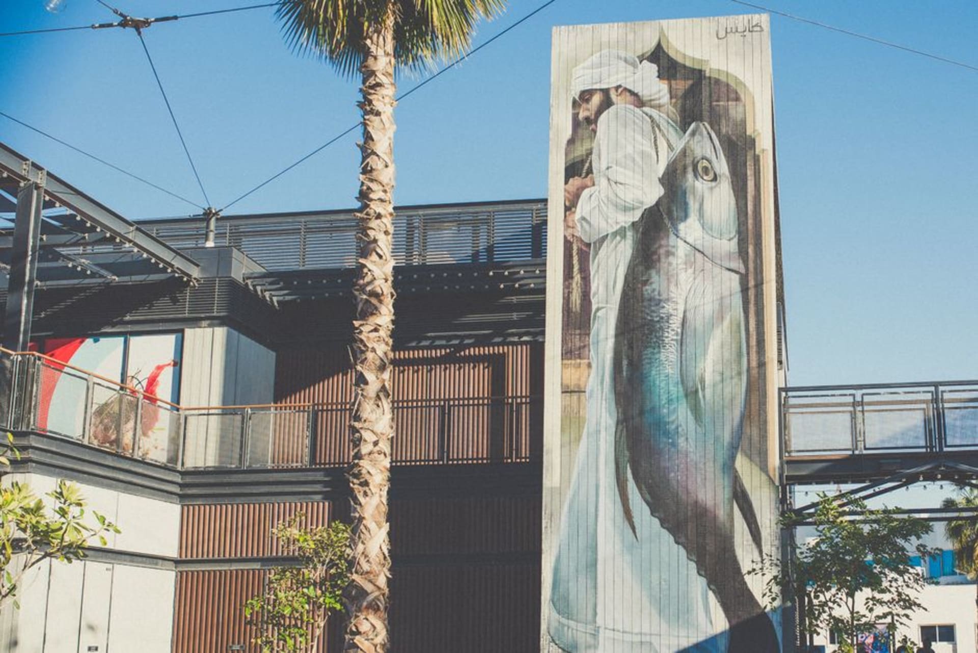 Colorful street art murals along the beachfront promenade at La Mer, Jumeirah