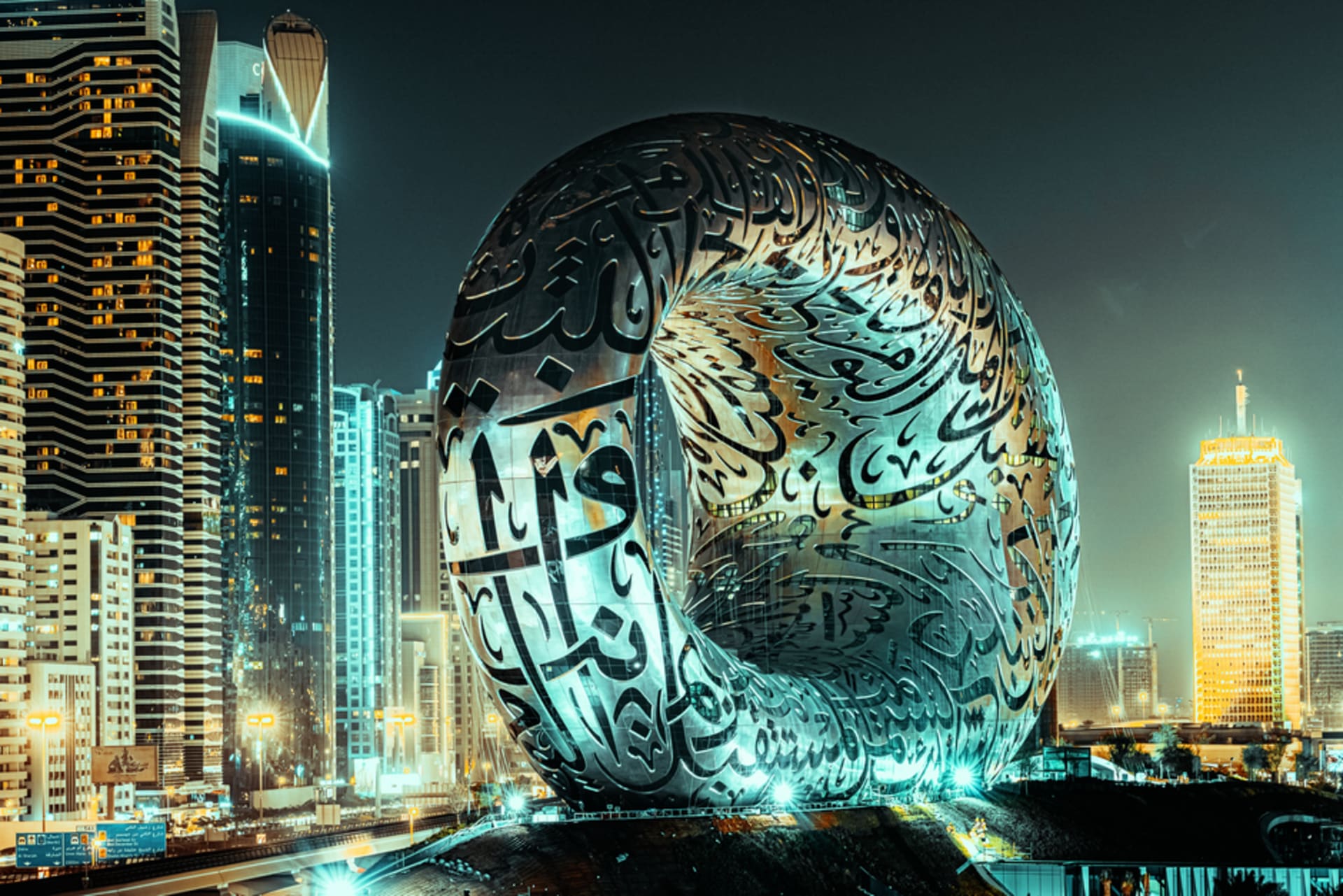The silver torus-shaped Museum of the Future building with Arabic calligraphy facade in Dubai