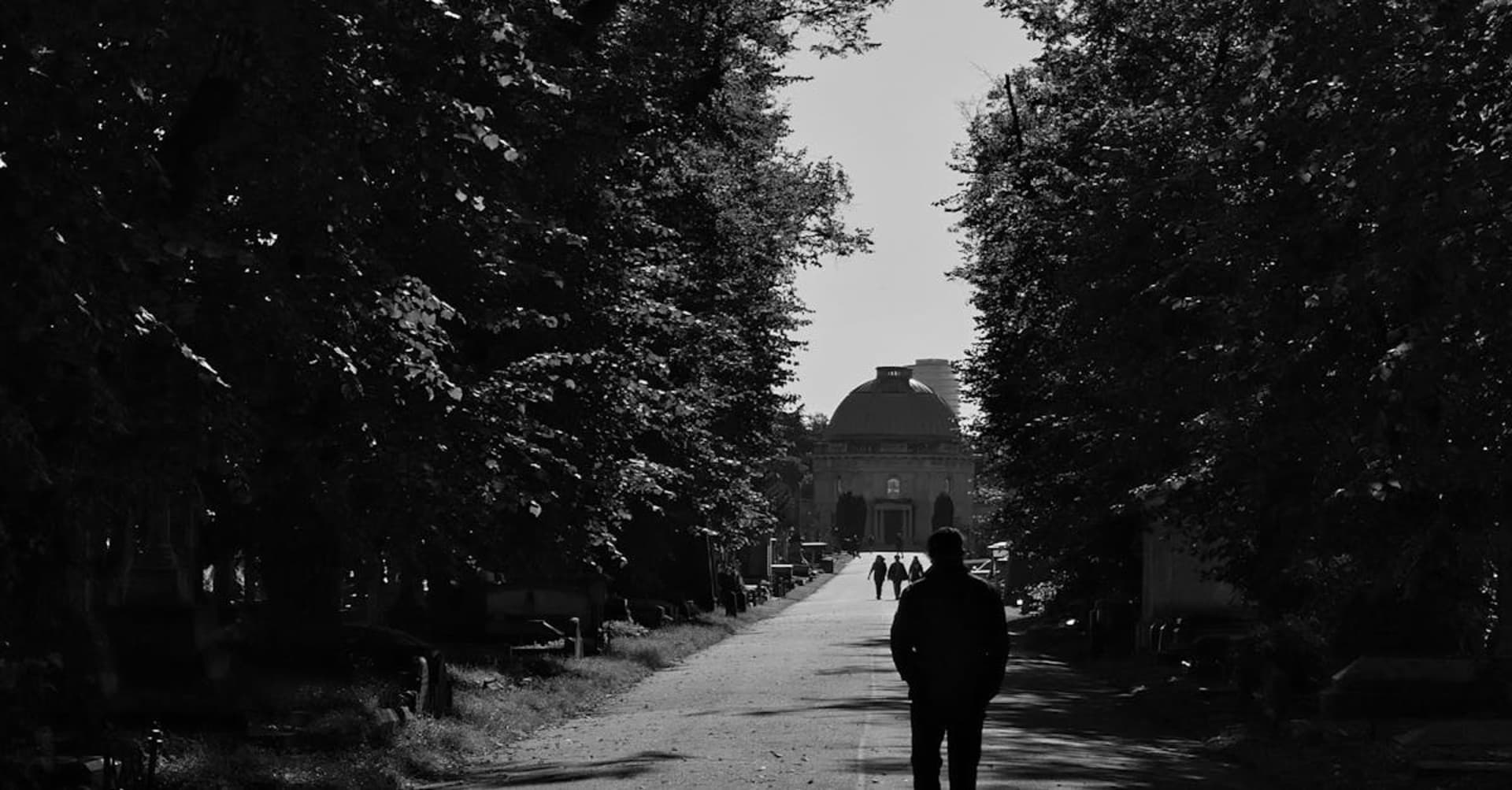 The Houses of Parliament and Big Ben silhouetted against a dramatic sunset over the Thames