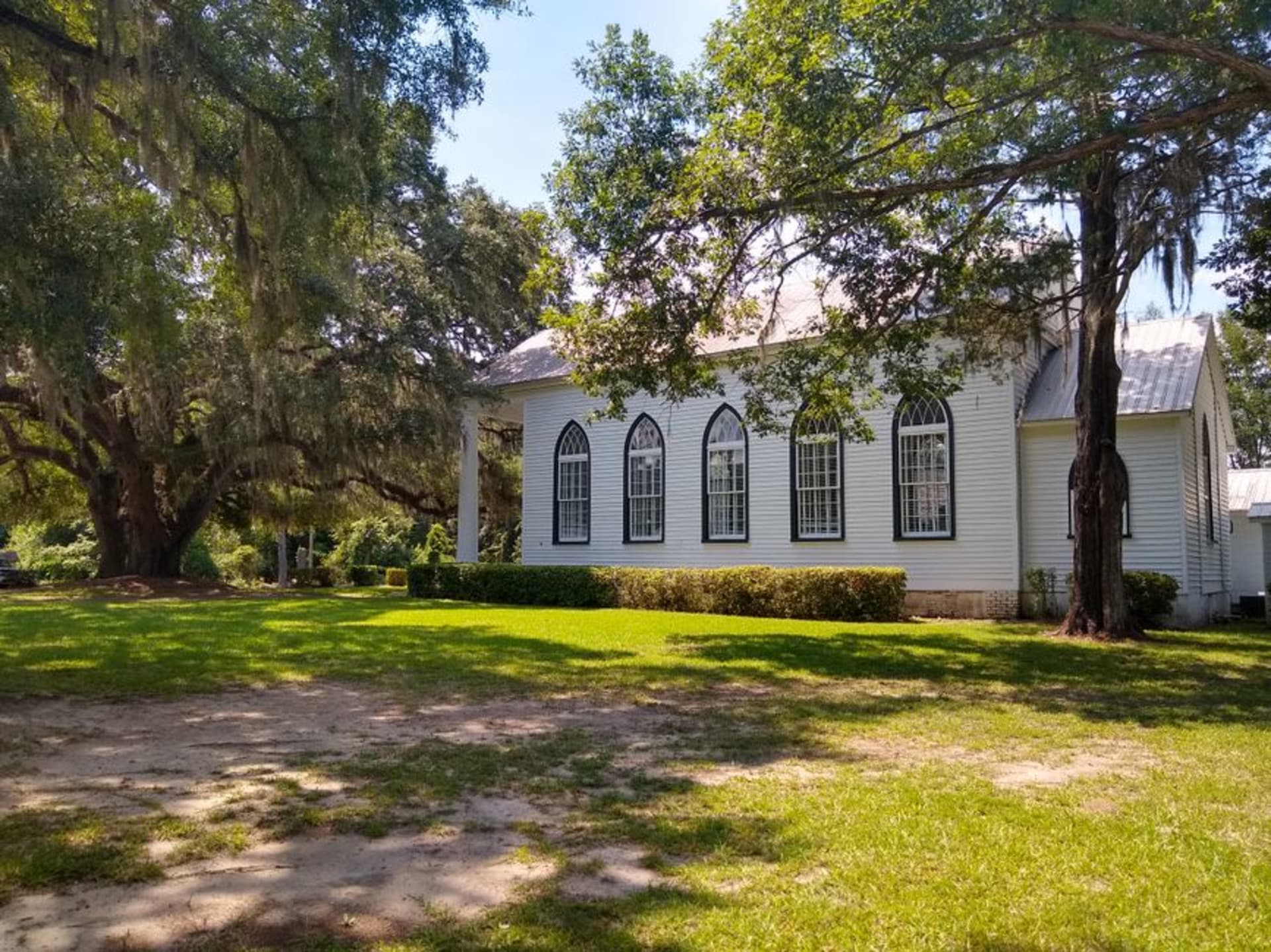 Live oaks draped in Spanish moss over a historic street in Old Town Bluffton, South Carolina
