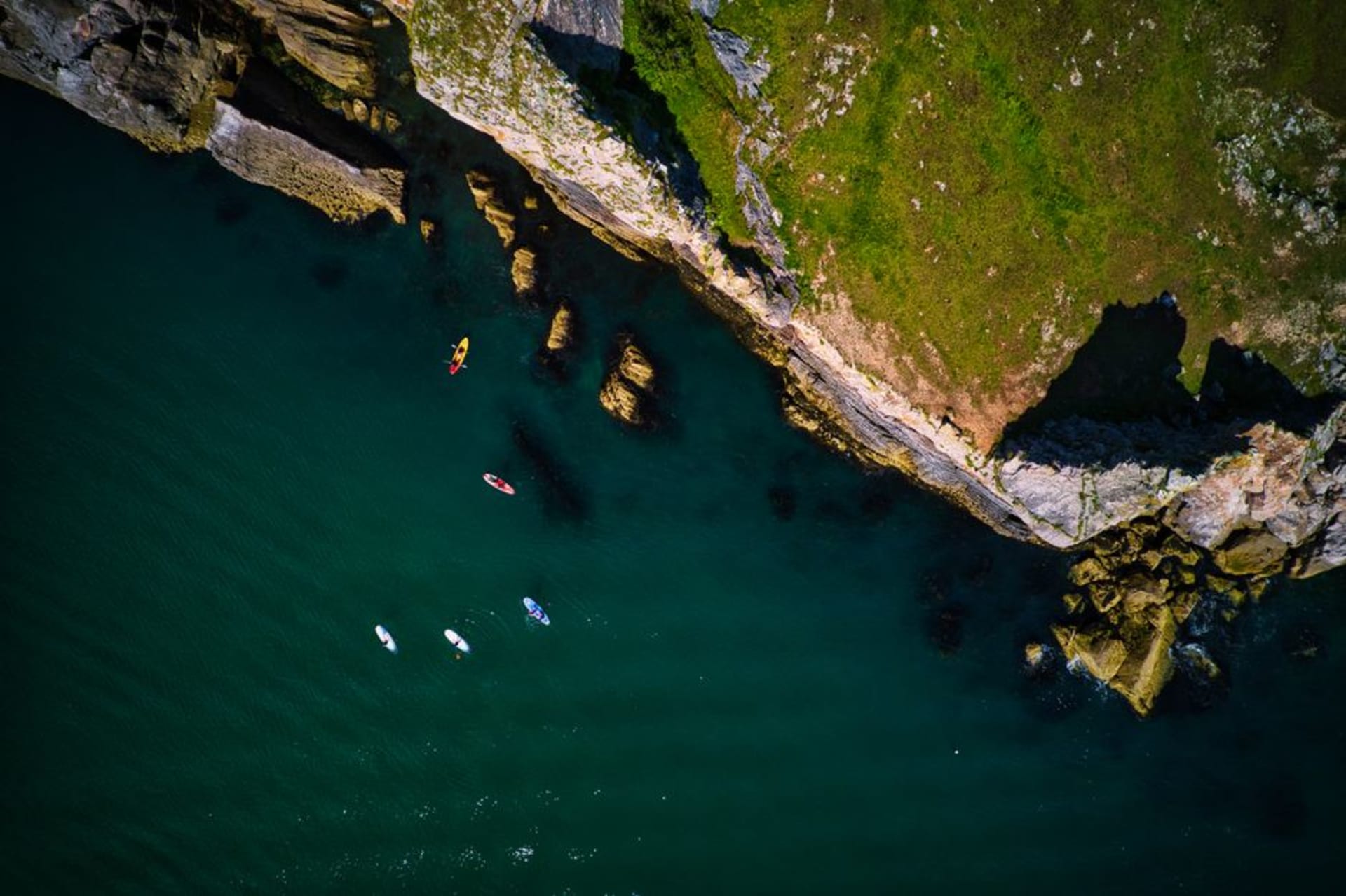 Rugged sea cliffs of a Channel Island dropping into deep blue Pacific water