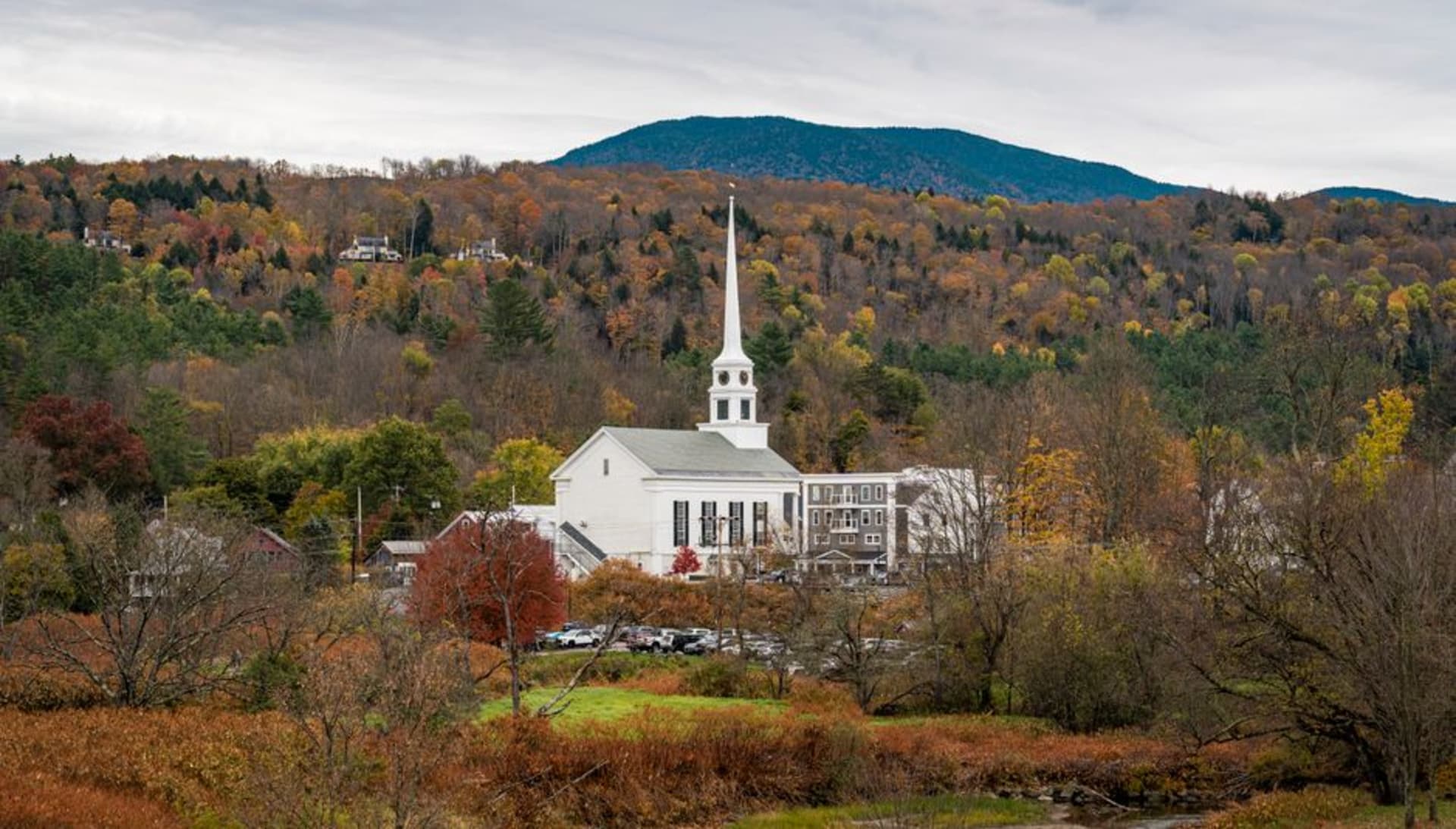 The classic village green in Dorset, Vermont ringed by white historic buildings