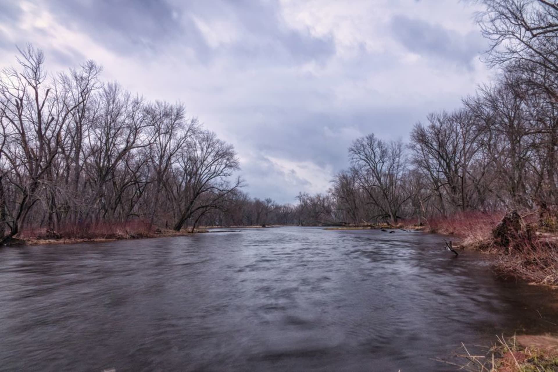 The Kankakee River flowing past limestone bluffs near downtown Kankakee, Illinois