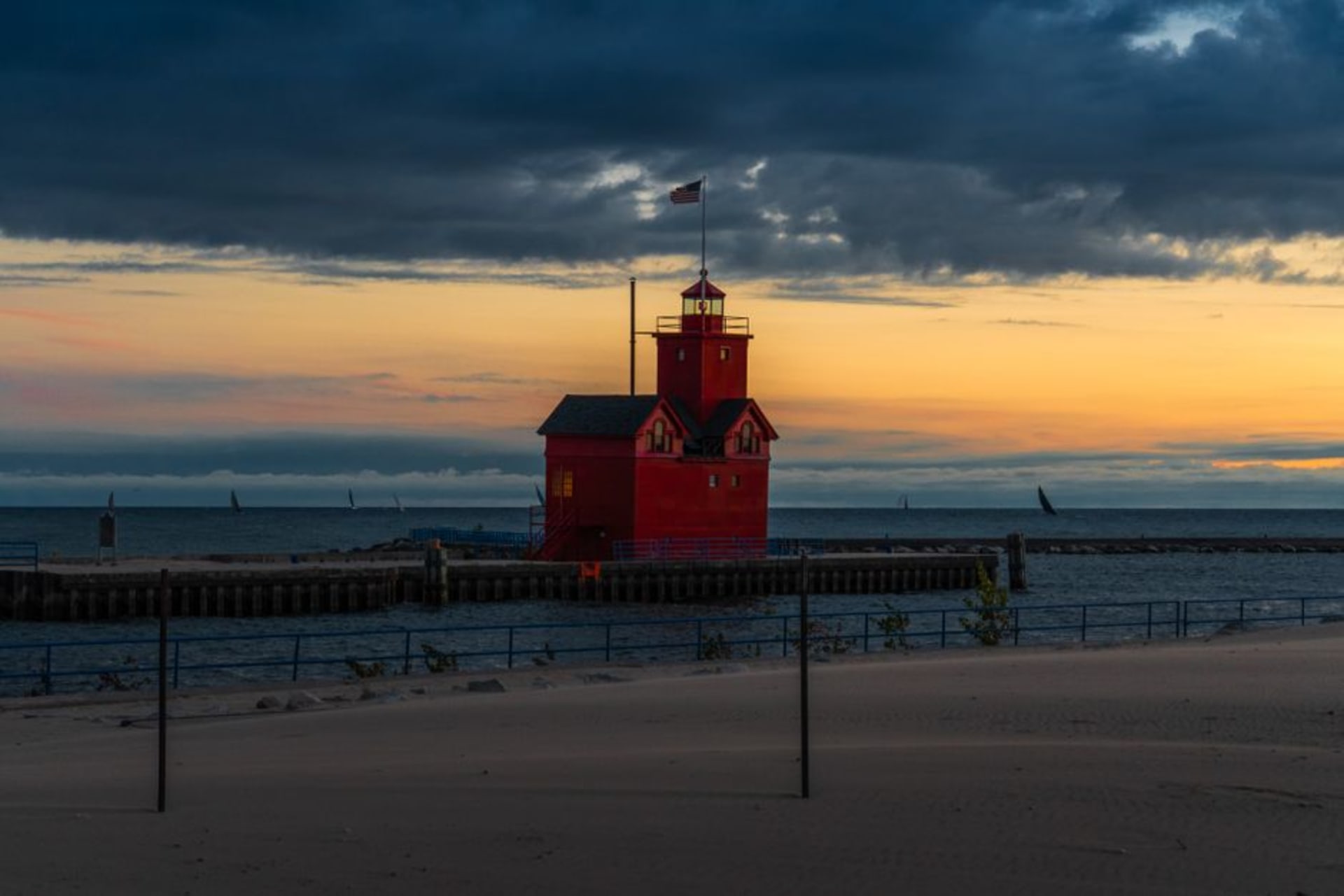 The historic Old Michigan City Lighthouse against Lake Michigan at dusk