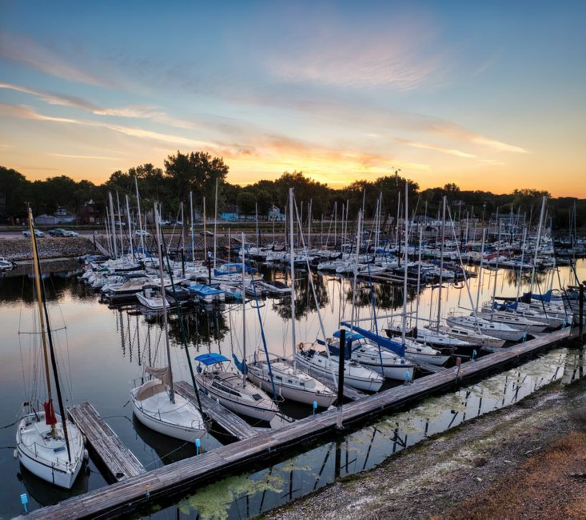 Sailboats on Lake Winnebago with the Oshkosh waterfront skyline in Wisconsin