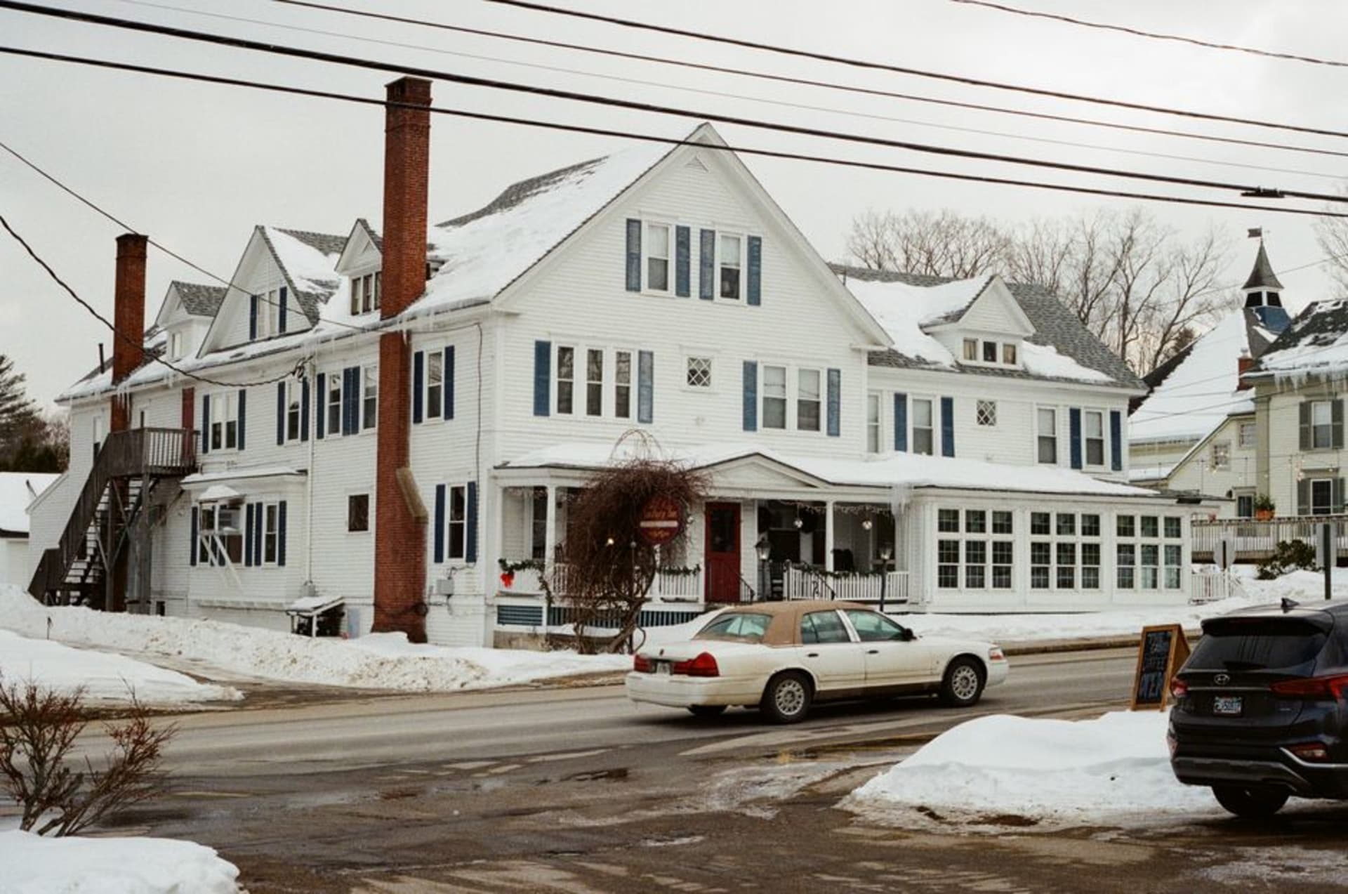 Historic Main Street with white clapboard houses and elm trees in Ridgefield, Connecticut