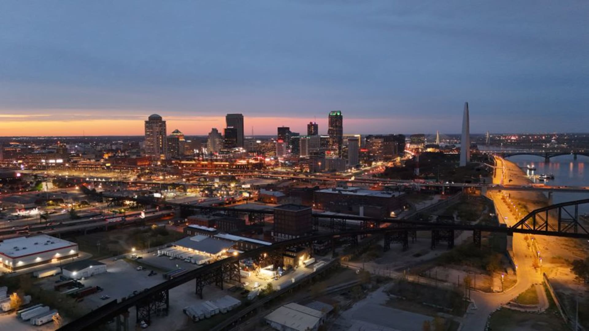The Gateway Arch rising above the St Louis riverfront and the Mississippi River