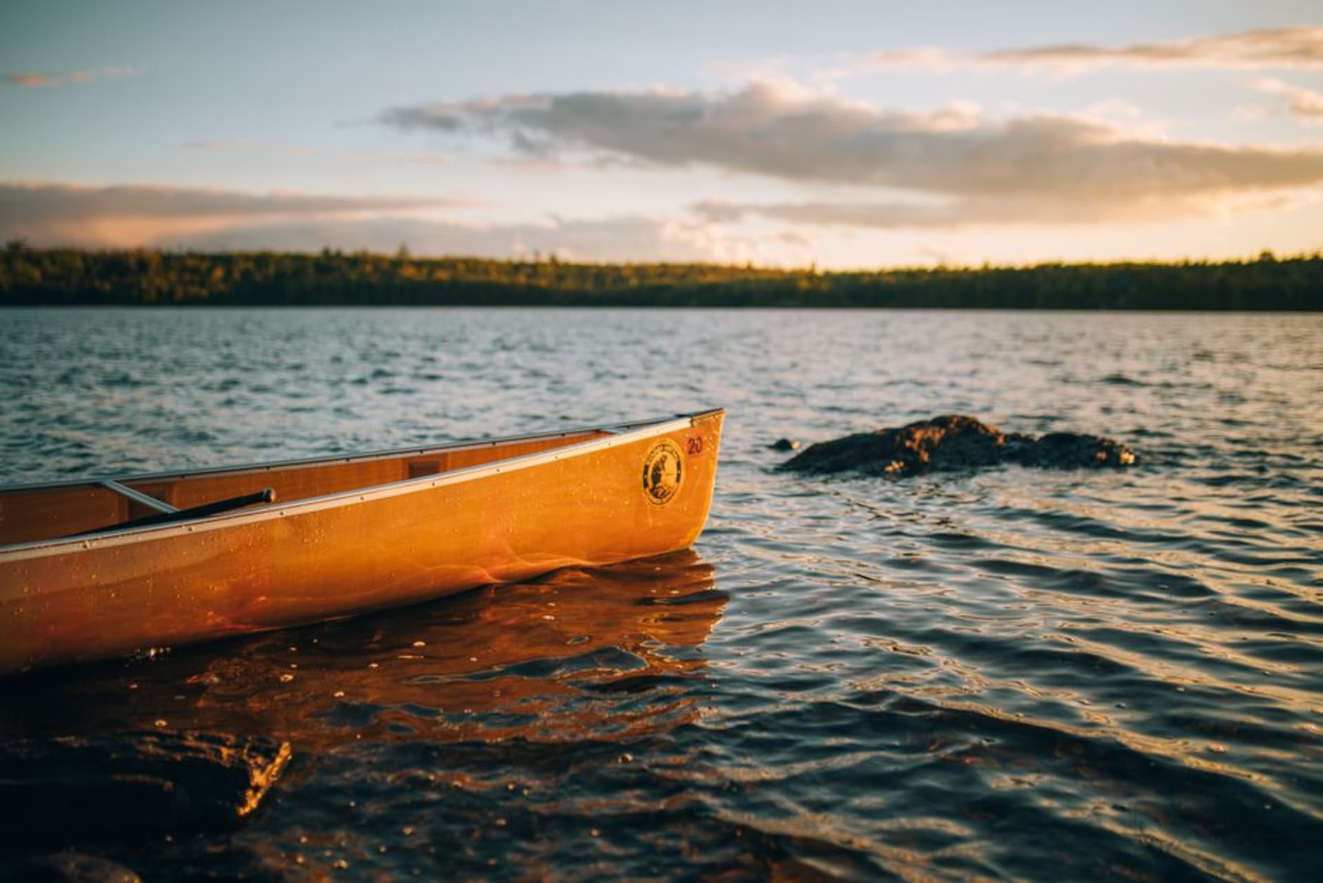 Calm interconnected lakes and pine-covered islands at Voyageurs under a wide sky