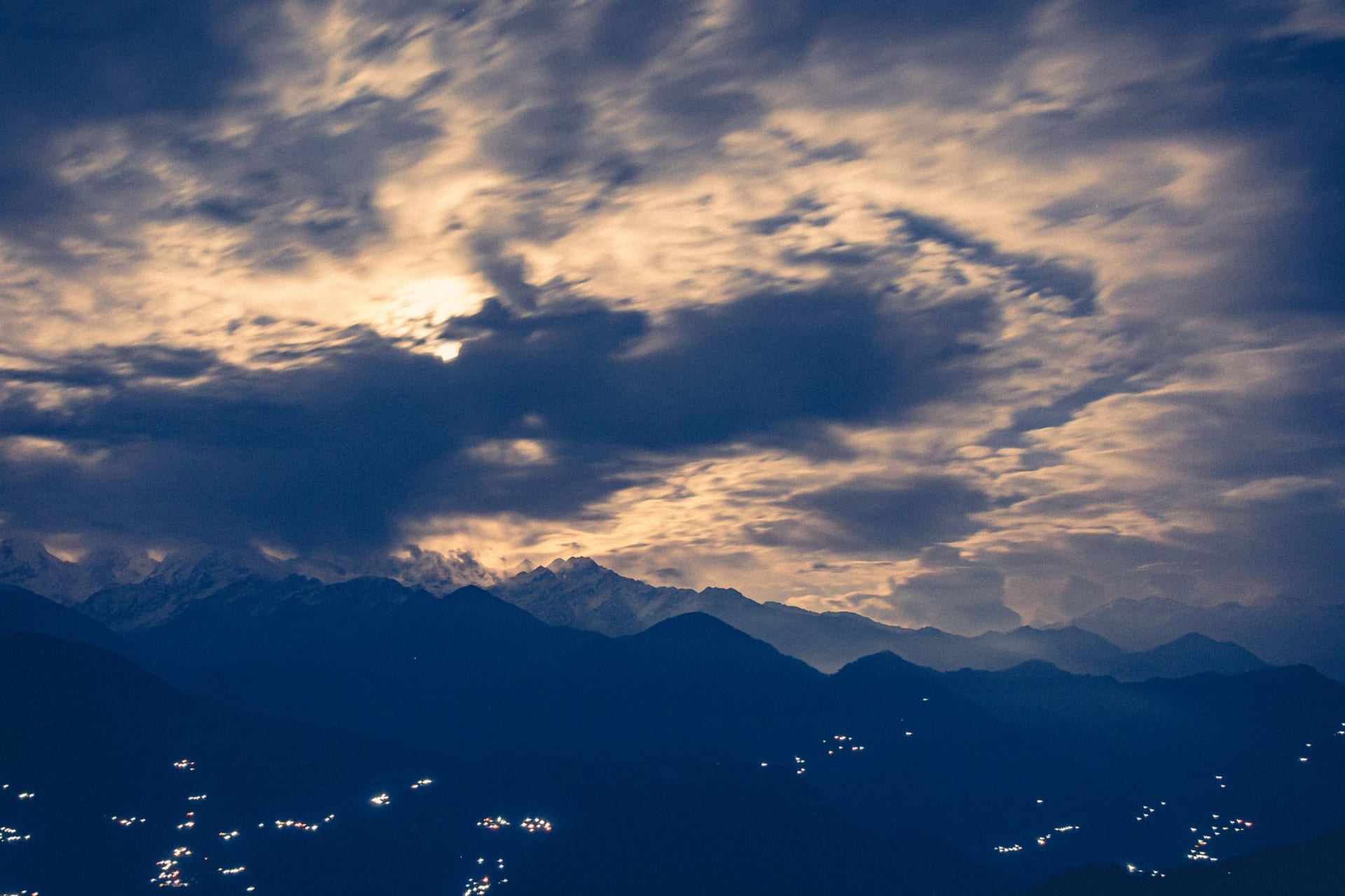 The five snow-capped peaks of the Panchachuli massif glowing at dawn above the ridges around Munsiyari village in Kumaon