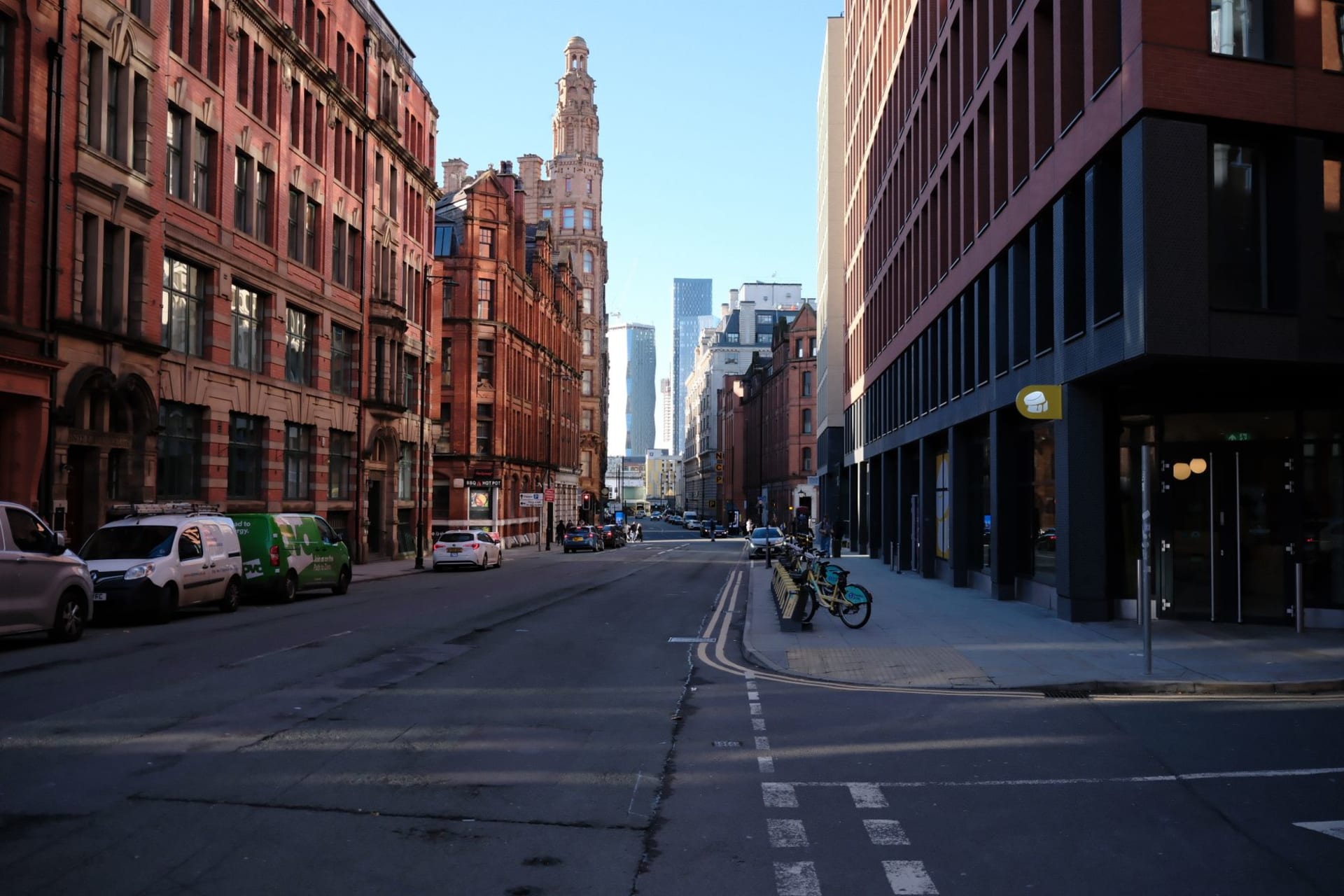 Main Street Manchester with marble sidewalks and Green Mountains rising sharply behind Victorian storefronts